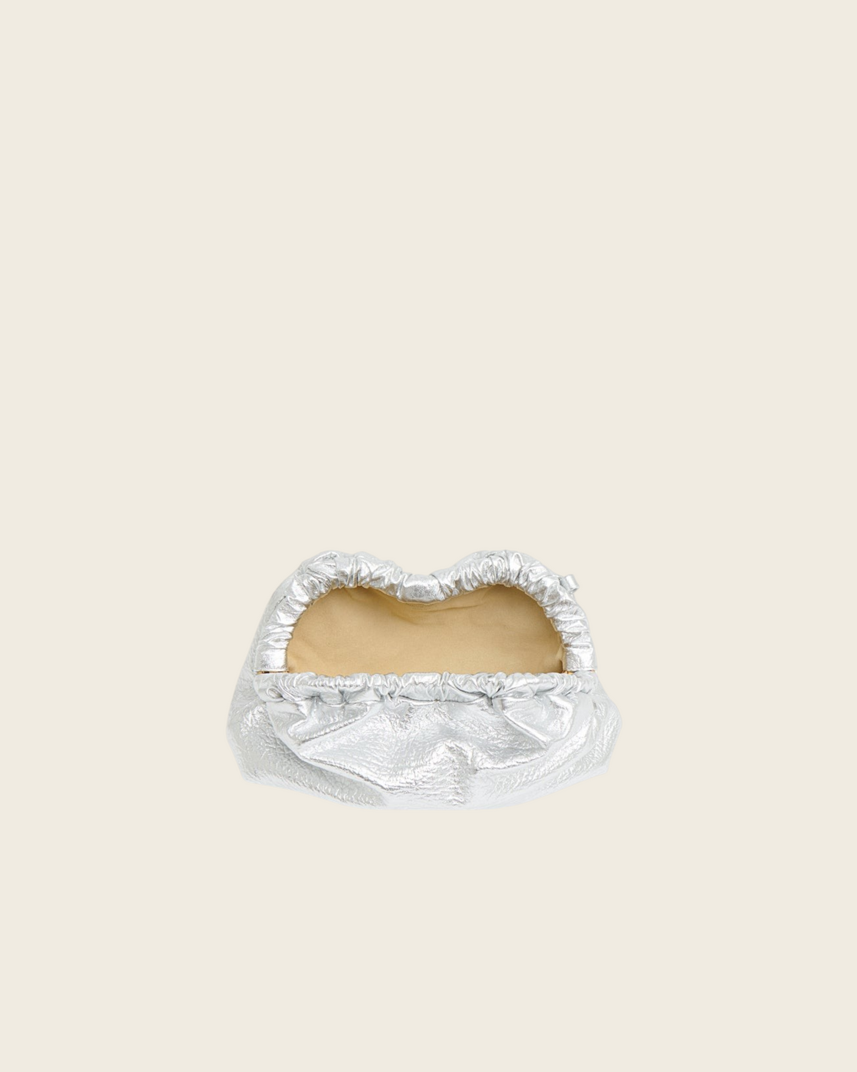 Weldun Mansur Gavriel Mini Cloud Clutch in tumbled silver metallic lambskin leather with a curved magnetic frame.