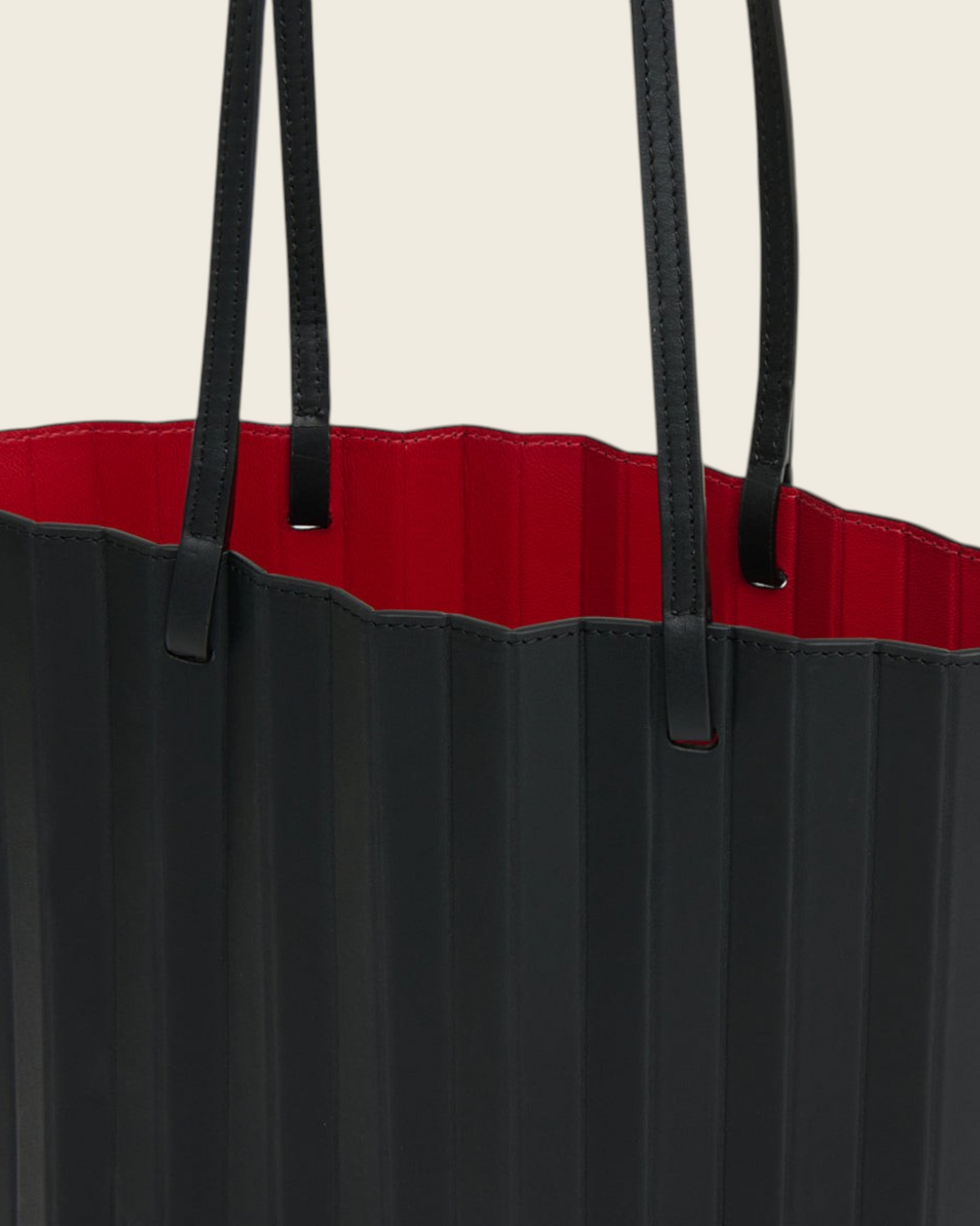 Weldun Mansur Gavriel black hand-pleated Italian leather tote bag with a vibrant red interior and shoulder straps.