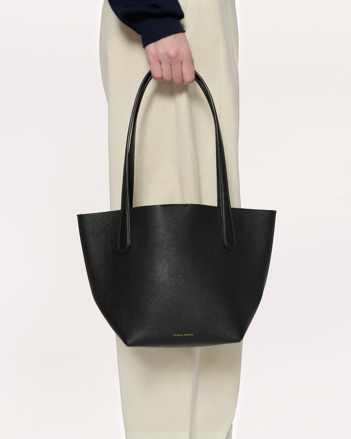 Weldun Mansur Gavriel small black calf leather everyday tote bag with minimalist silhouette and Bombay handles