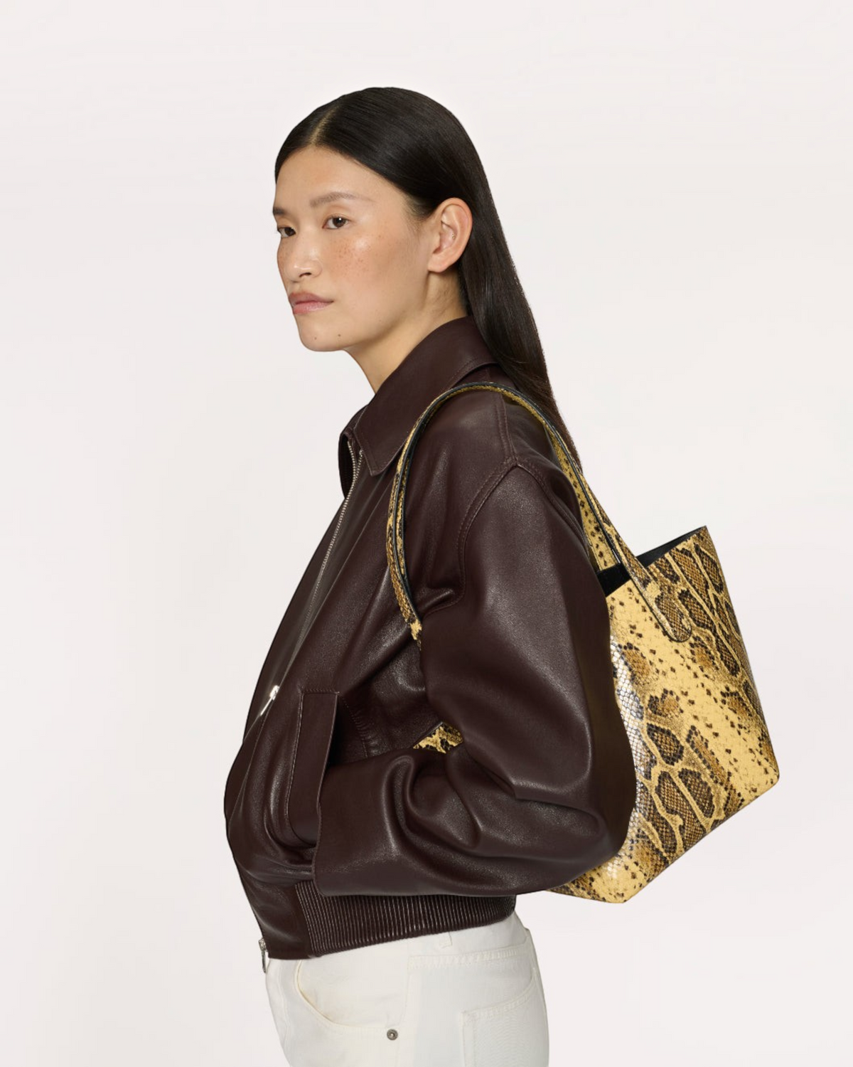 Weldun Mansur Gavriel small everyday soft tote in golden roccia printed Italian goat leather on a model