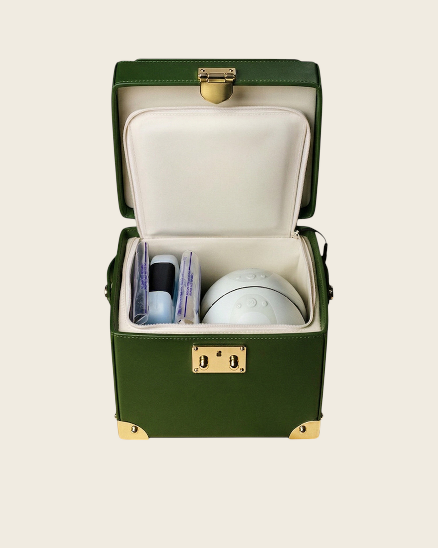Weldun Themis breastmilk cooler in green nappa leather with gold hardware, showing the open insulated compartment.