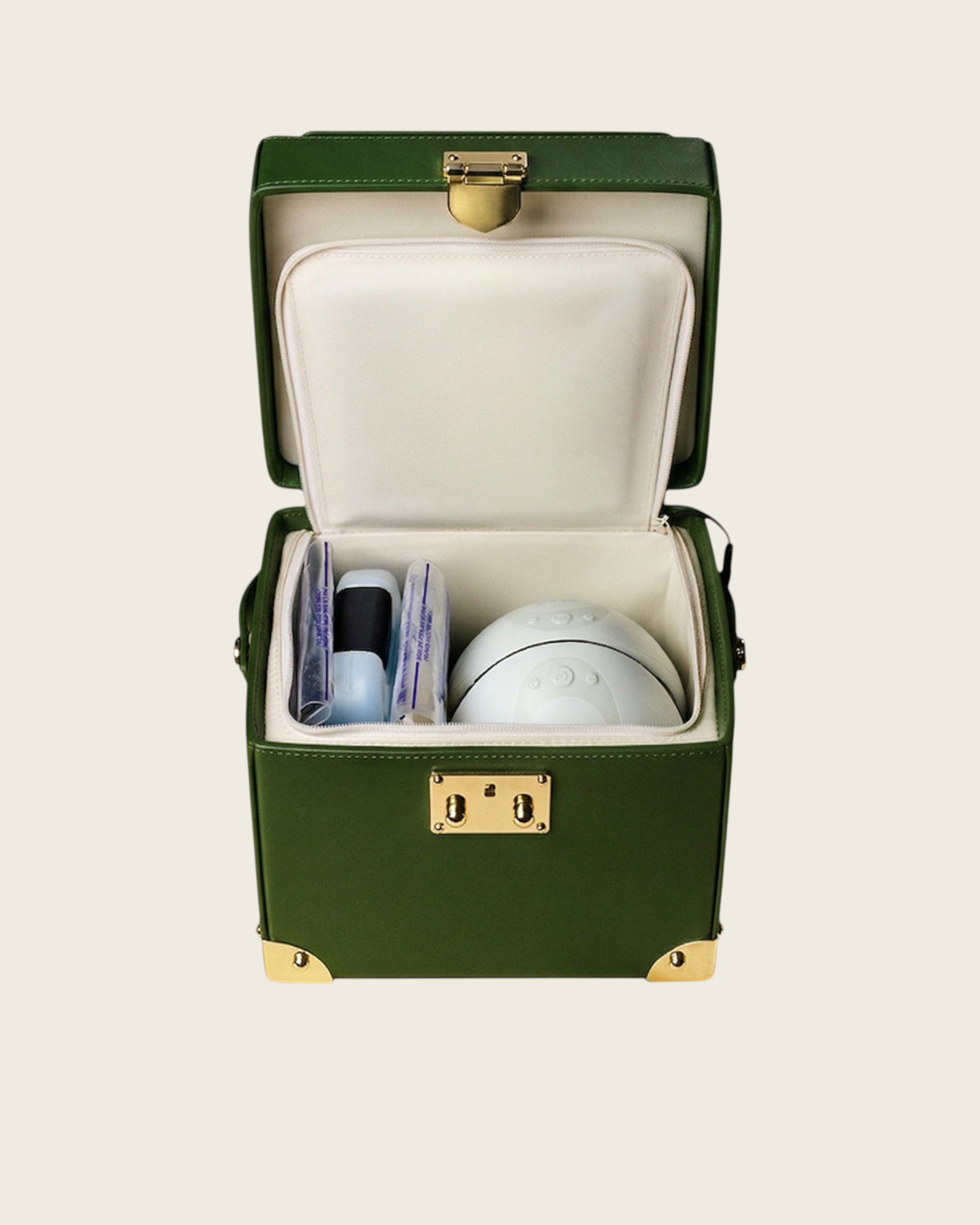 Weldun Themis breastmilk cooler in green nappa leather with gold hardware, showing the open insulated compartment.