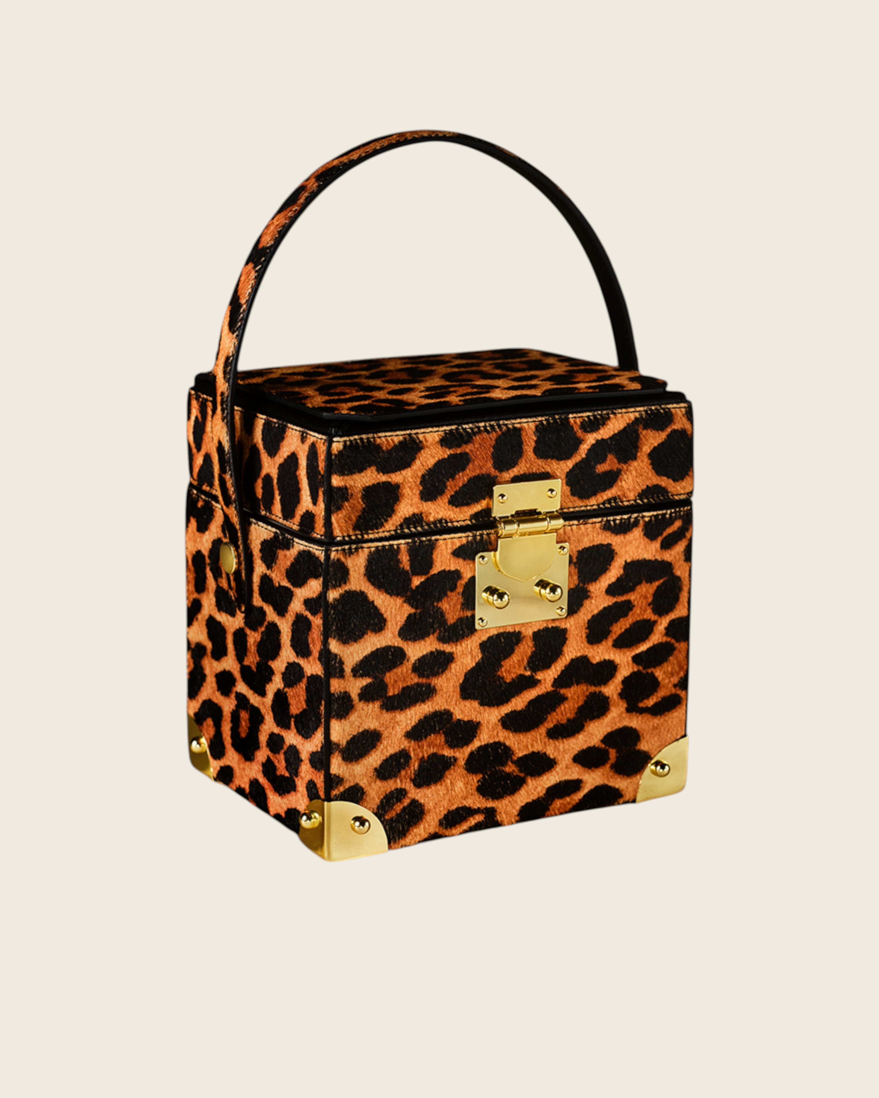 Weldun Themis breastmilk cooler handbag in leopard print nappa leather with gold hardware and top handle.