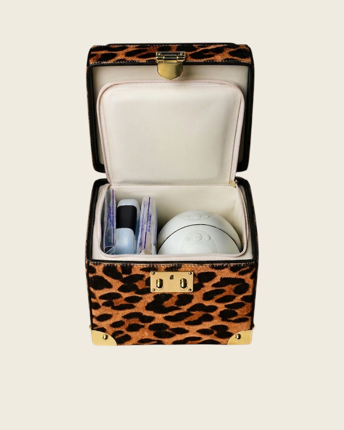 Weldun Themis breastmilk cooler in leopard print leather with gold hardware, shown open with internal storage.