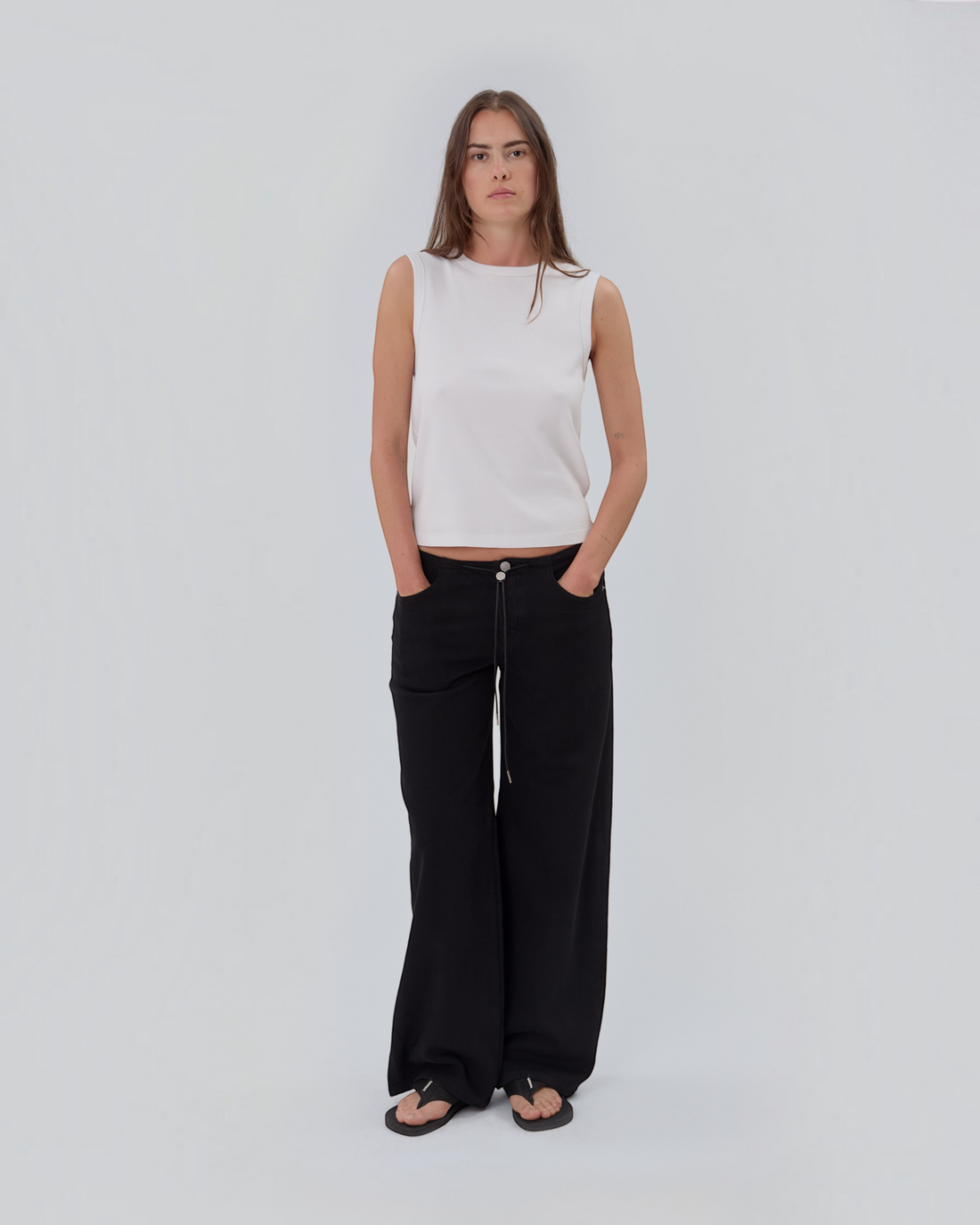 Weldun Still Here Cool Jean in black with relaxed leg, elastic drawstring waistband, and signature embroidery.