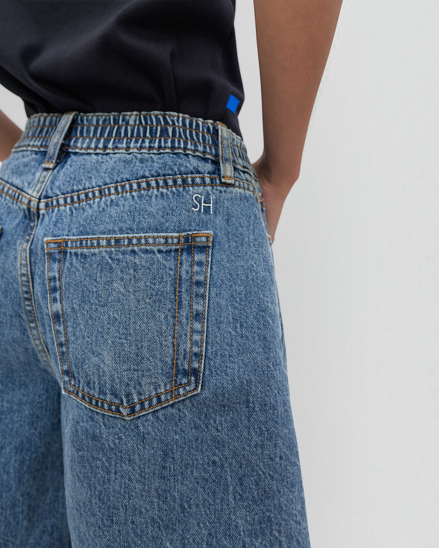 Weldun Lola high-waisted denim shorts in classic blue with elastic scrunch waistband and SH embroidery detail