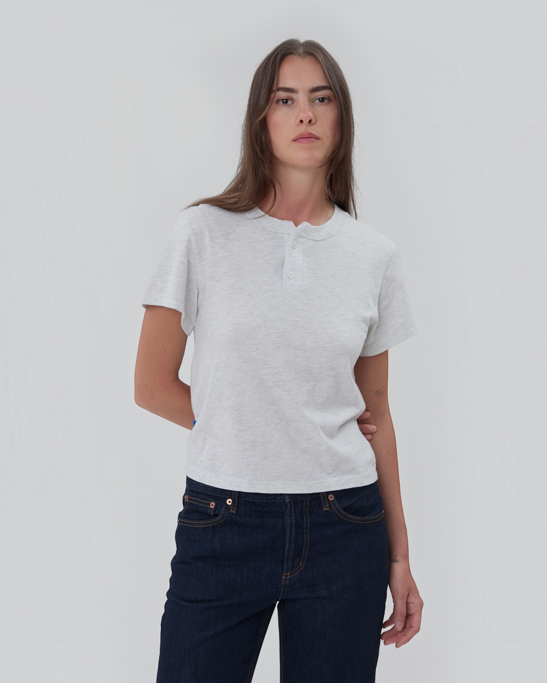 Weldun Still Here grey short sleeve cotton henley shirt with a two-button placket worn by a model