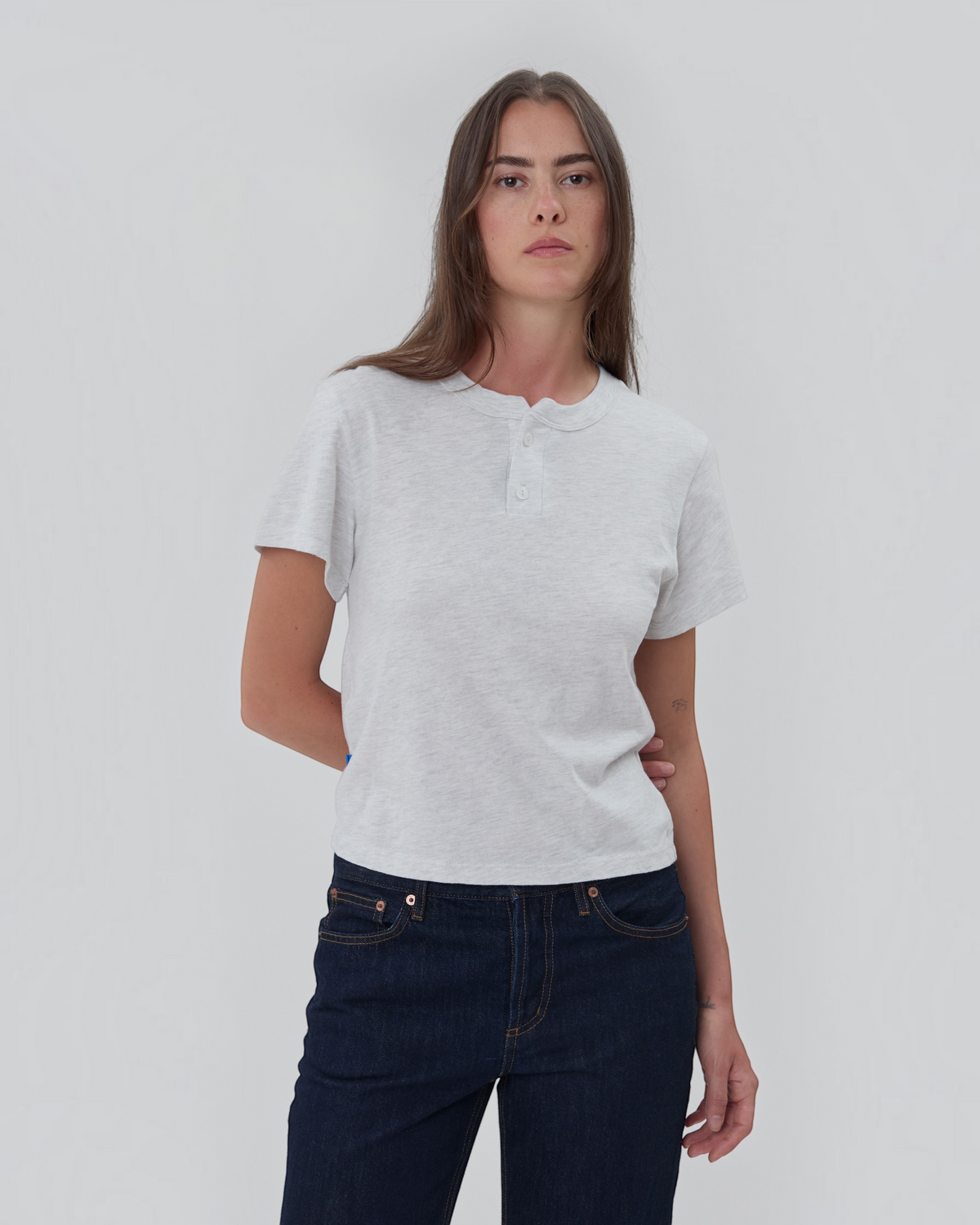 Weldun Still Here grey short sleeve cotton henley shirt with a two-button placket worn by a model