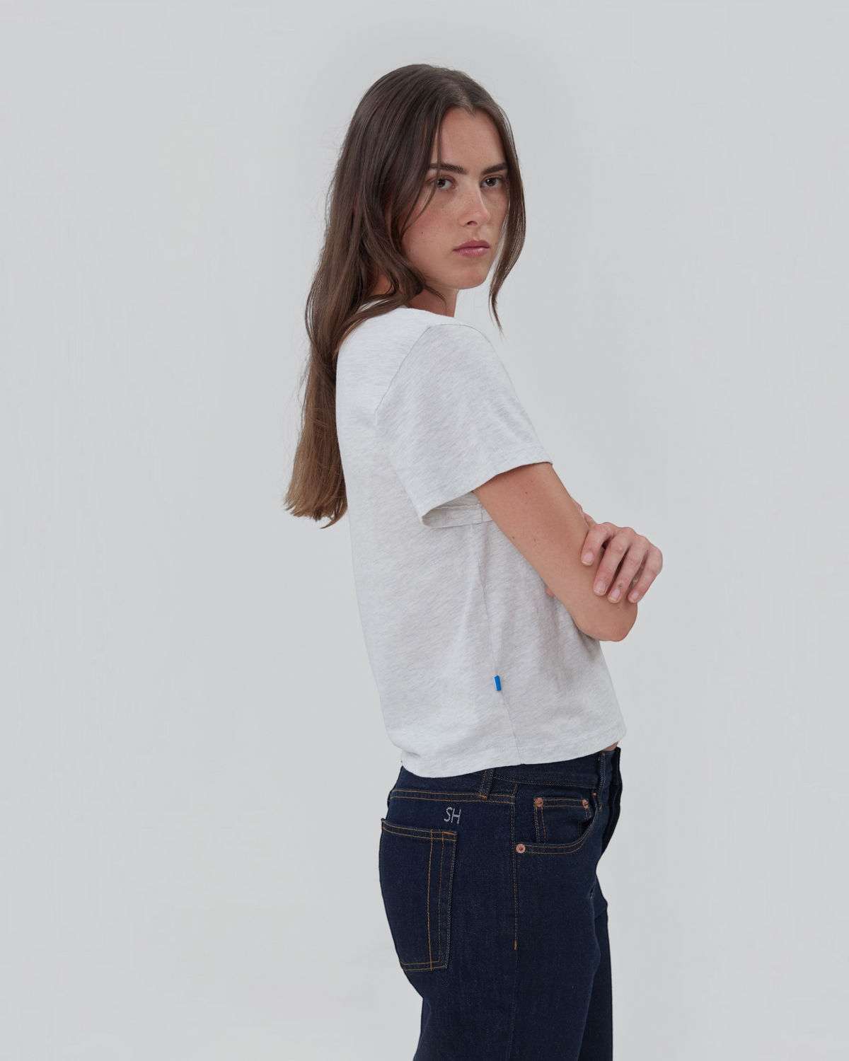 Weldun Still Here grey cotton short sleeve Henley shirt with two-button placket and blue side tab on a model