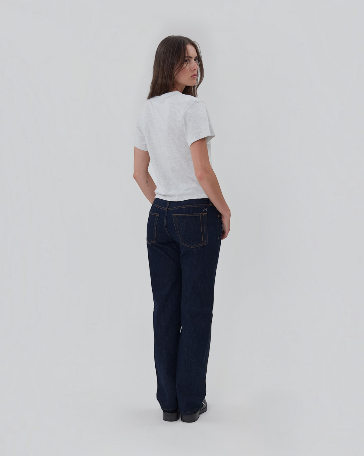 Weldun Still Here grey cotton short sleeve Henley shirt worn by a model from the back view