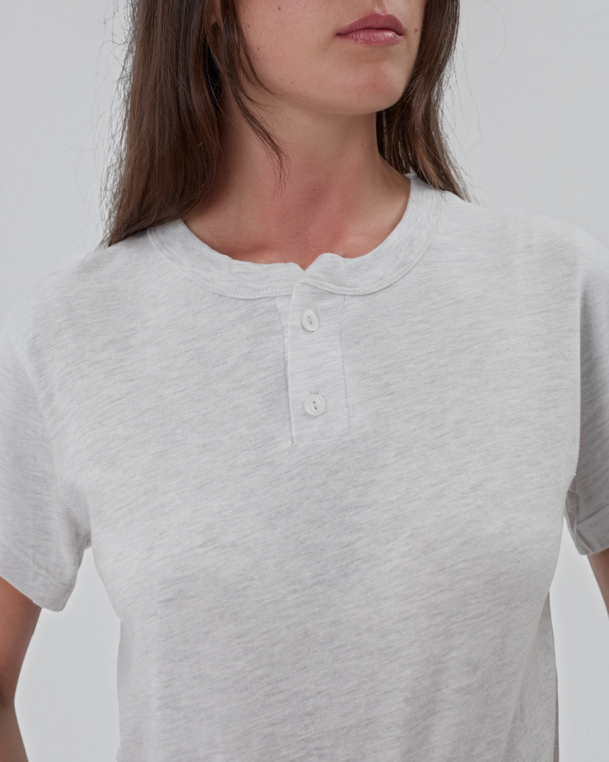 Weldun grey short sleeve cotton henley shirt with a two-button placket and crewneck on a model