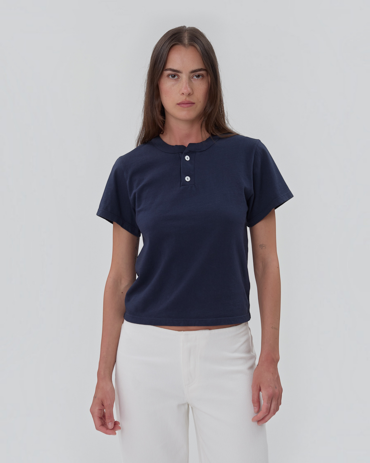 Weldun navy blue short sleeve Henley shirt in 100% cotton with a two-button placket worn by a model.