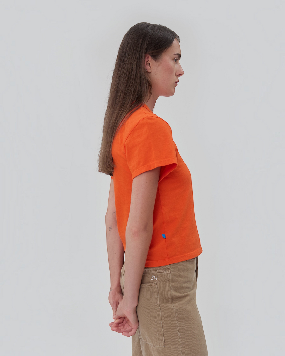 Weldun Still Here orange 100% cotton short sleeve Henley shirt with a two-button placket and blue side tab