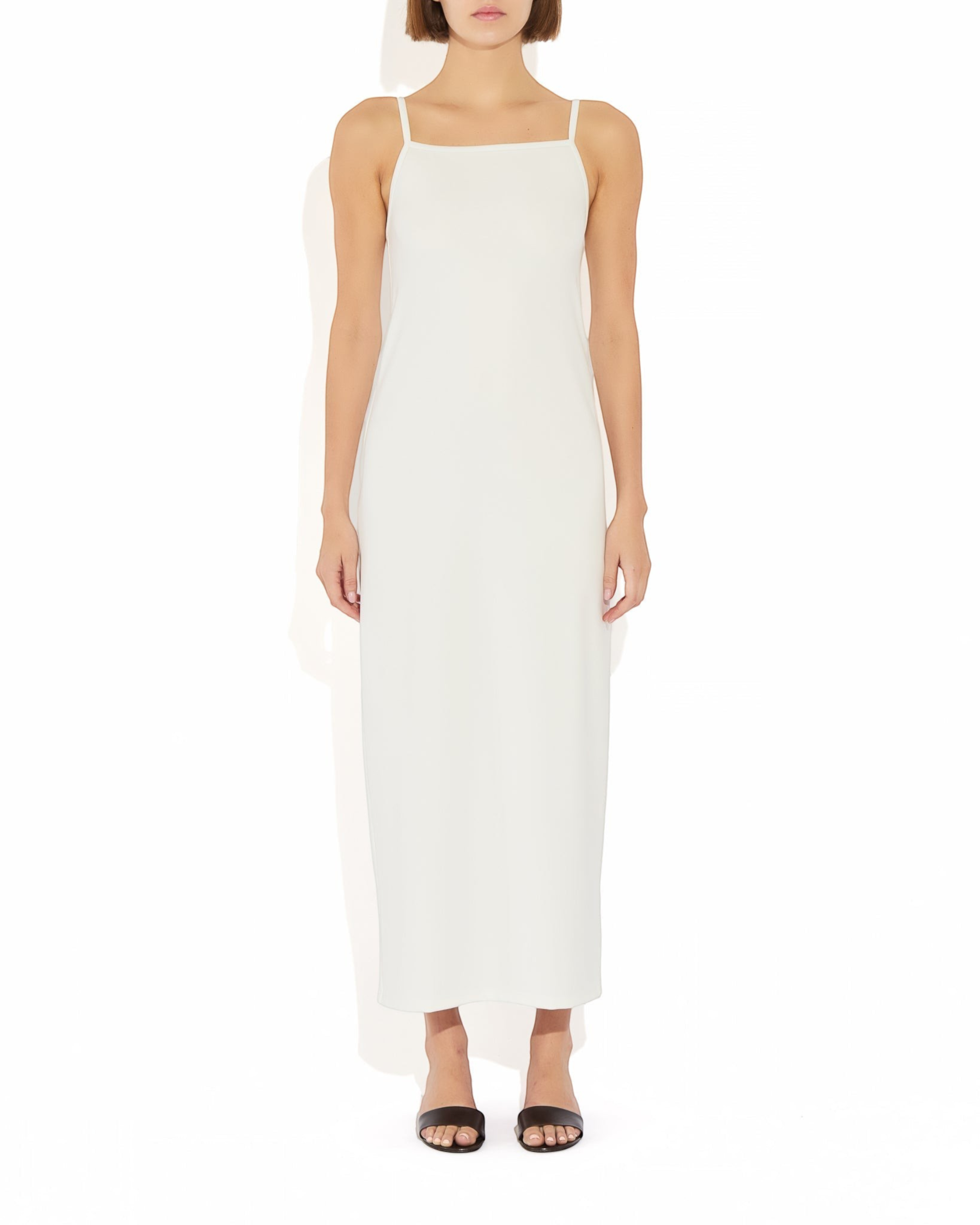 Weldun Alexandra maxi column dress in white with a square neckline and thin straps, made from soft stretch fabric.