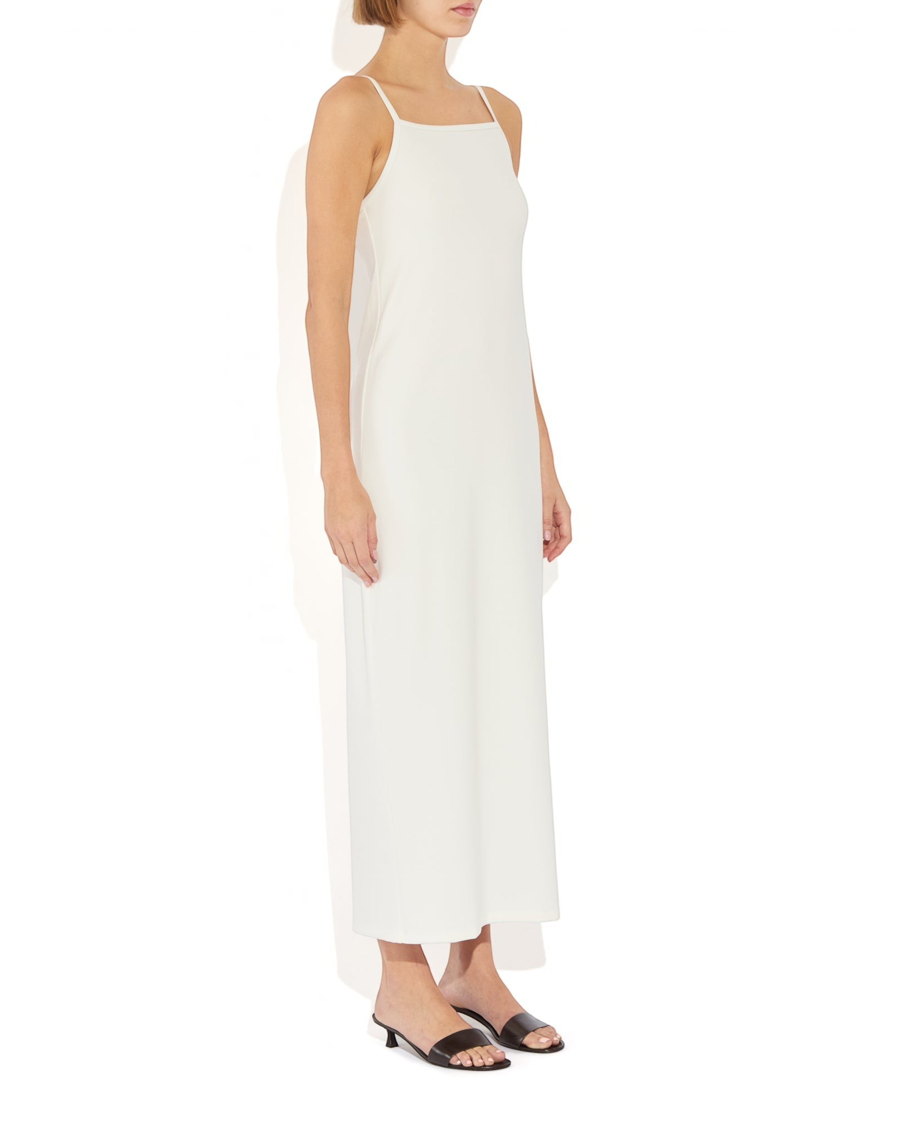 Weldun Alexandra white maxi column dress with thin straps and square neckline worn by a model
