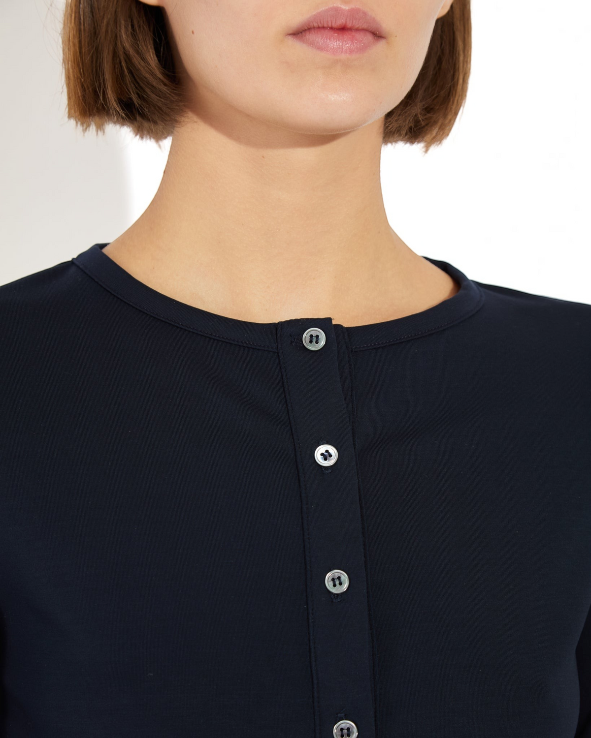 Weldun Arely Cardigan in navy blue MicroTencel fabric featuring a round neckline and delicate button-front detail.