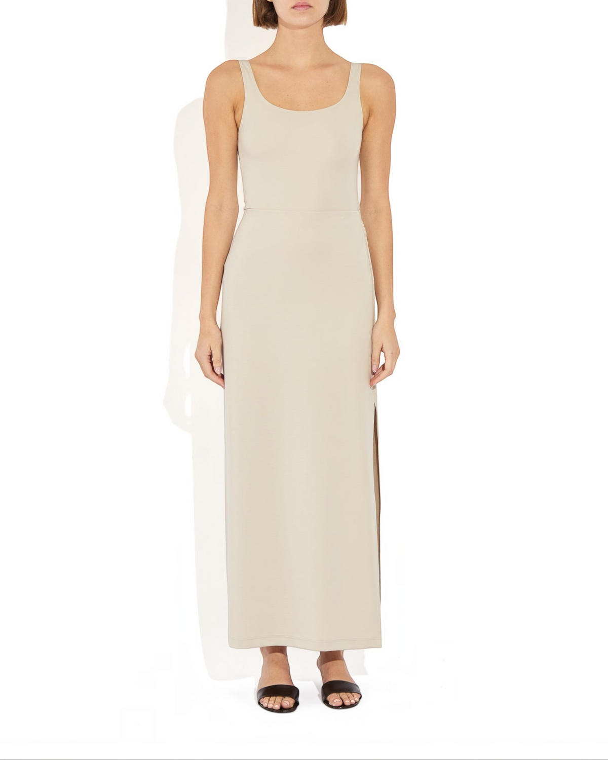 Weldun Ashley Skirt in beige, a minimal column silhouette with a side slit made from soft stretch PYRATEX fabric.