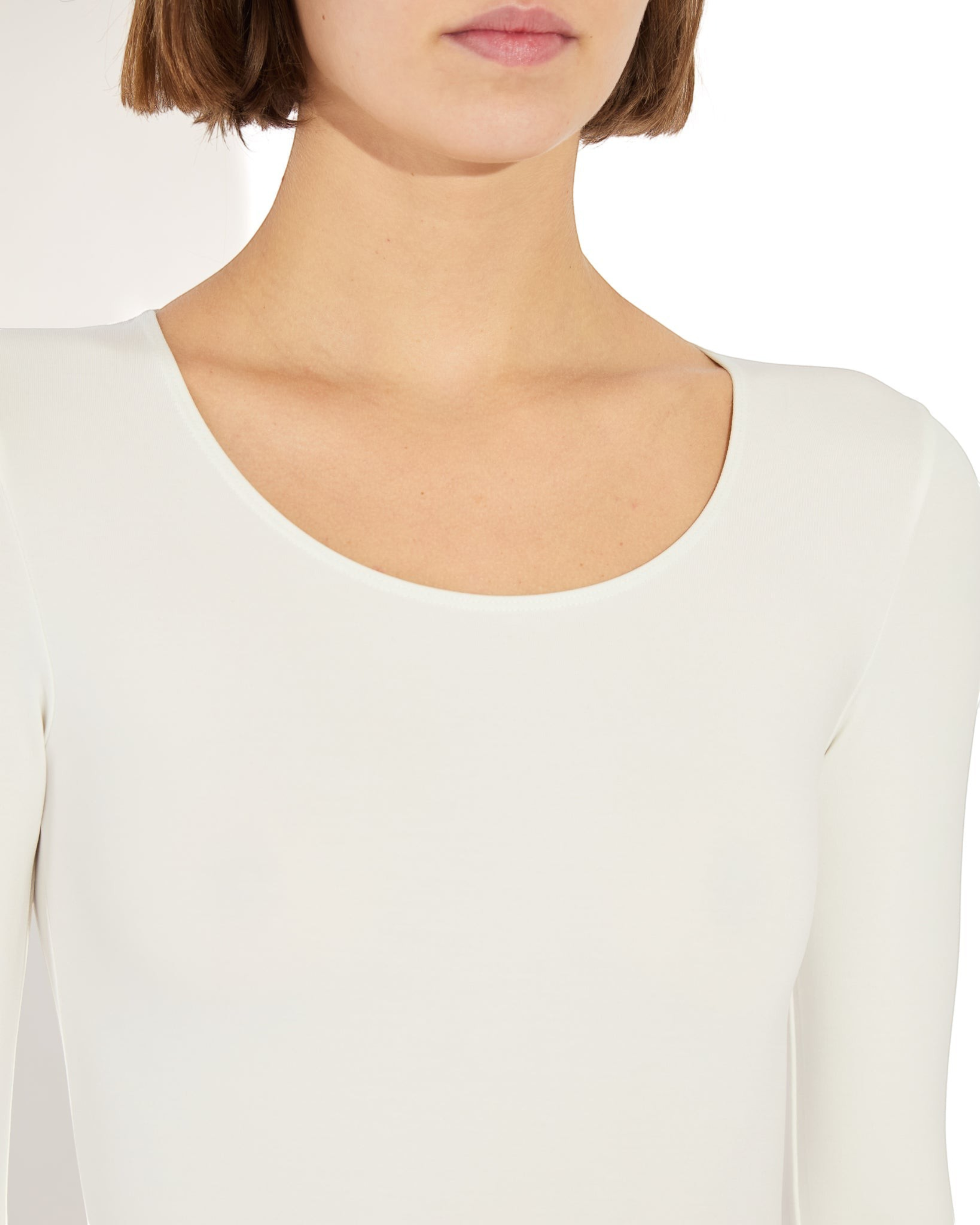 Weldun Donna long-sleeve bodysuit in white stretch-knit fabric with a scoop neckline worn by a model