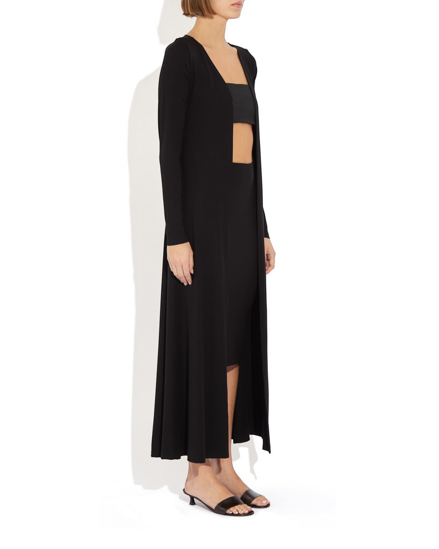 Weldun Julia Cardigan in black, a long open-front fluid layer made from soft, breathable PYRATEX Power 3 fabric.