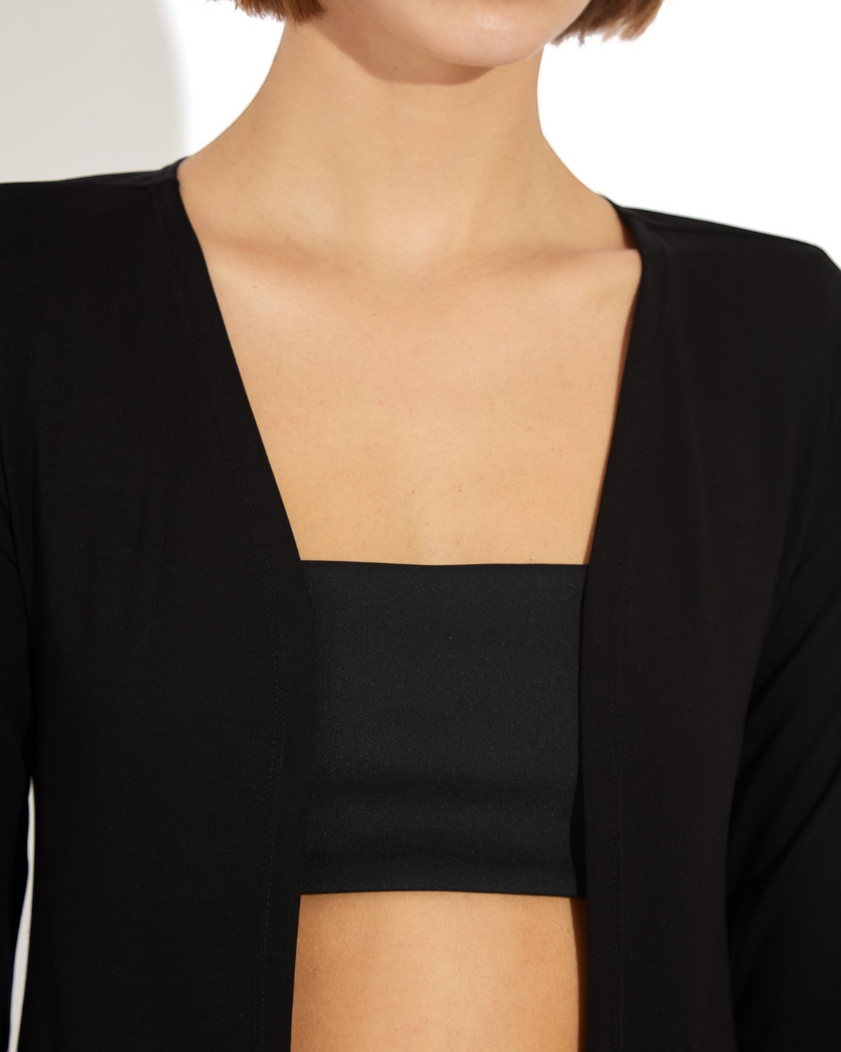Weldun Julia Cardigan in black, featuring an open-front design made from soft, breathable PYRATEX Power 3 fabric.