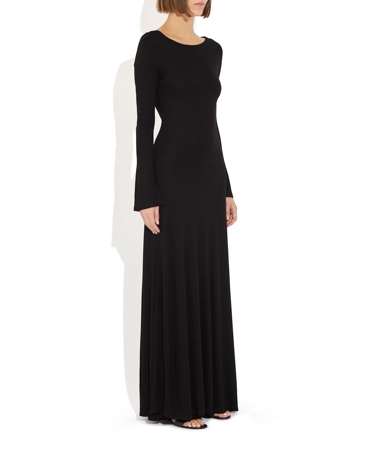 Weldun Lesley floor-length black jersey dress with boat neckline and bell sleeves worn by a model