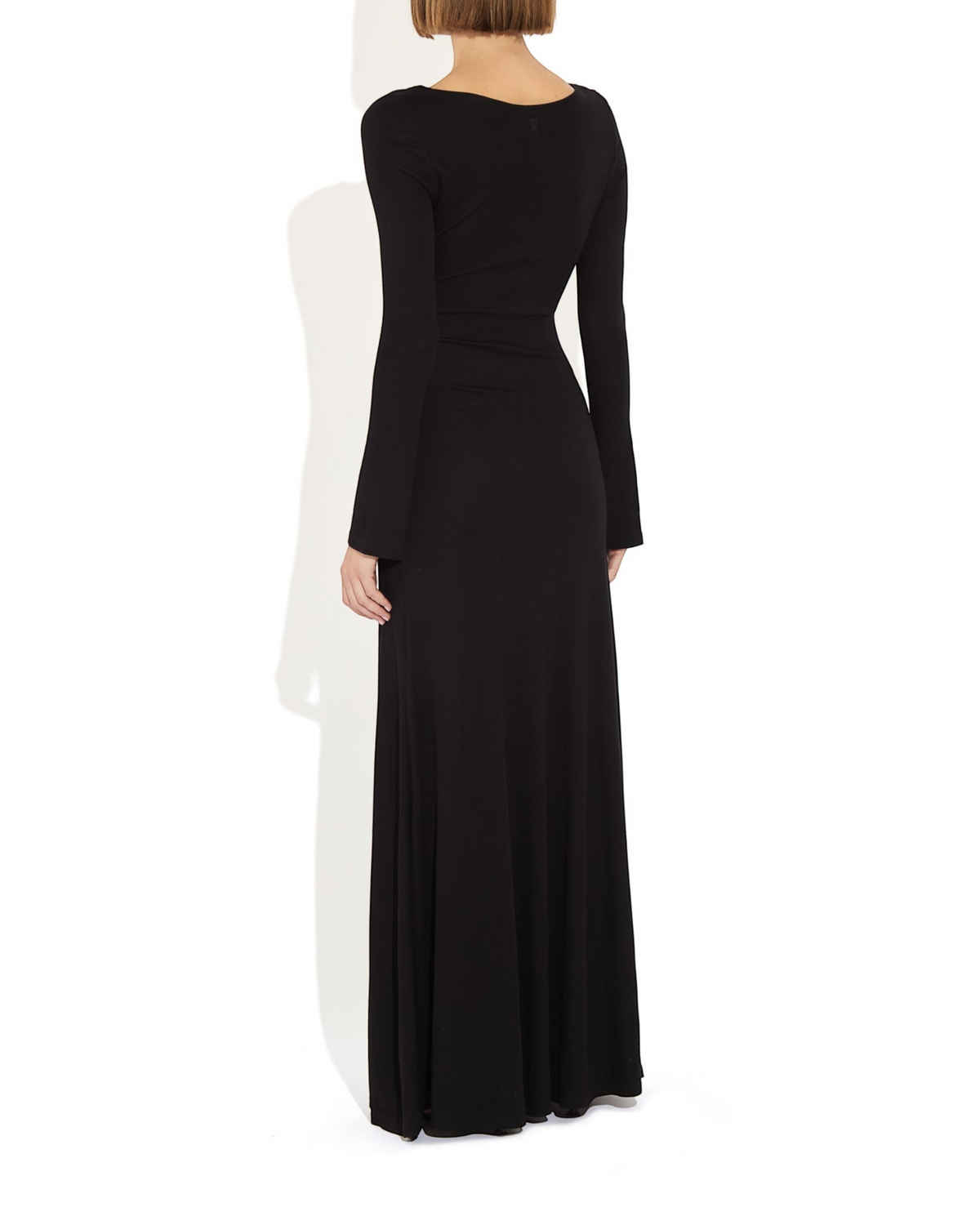 Back view of Weldun Lesley Dress in black Circulose jersey with boat neckline and long bell sleeves