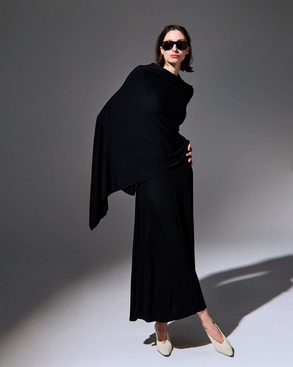 Weldun Lesley Dress in black Circulose jersey featuring a wide boat neckline and dramatic bell sleeves.