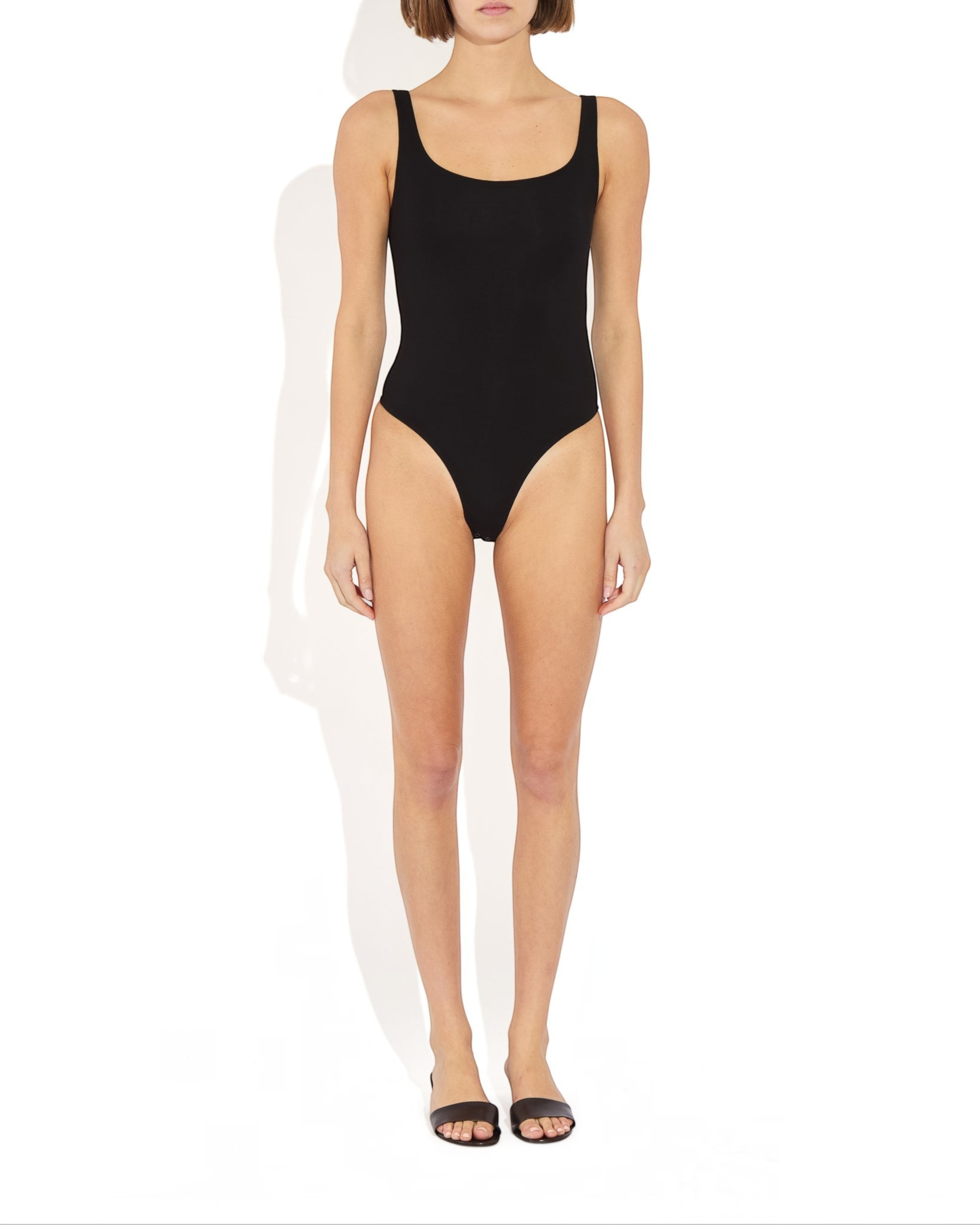 Weldun Lisa Bodysuit in black with a scoop neckline, thick straps, and a cheeky cut in breathable compressive fabric.