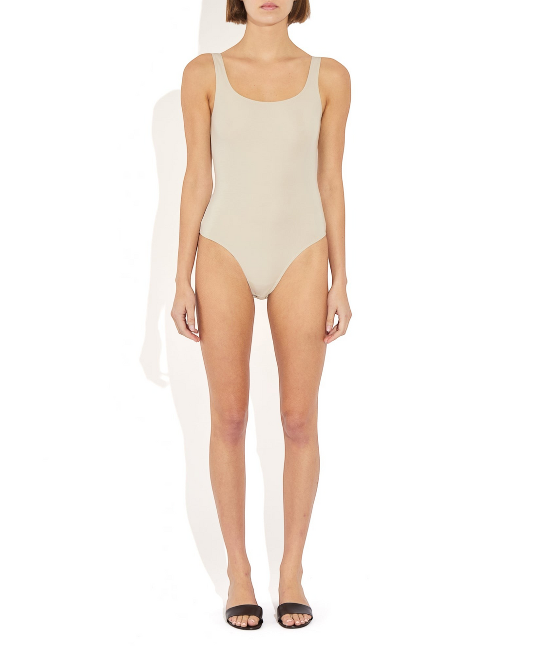 Weldun Lisa tank bodysuit in beige featuring a scoop neckline and supportive compressive fabric on a model
