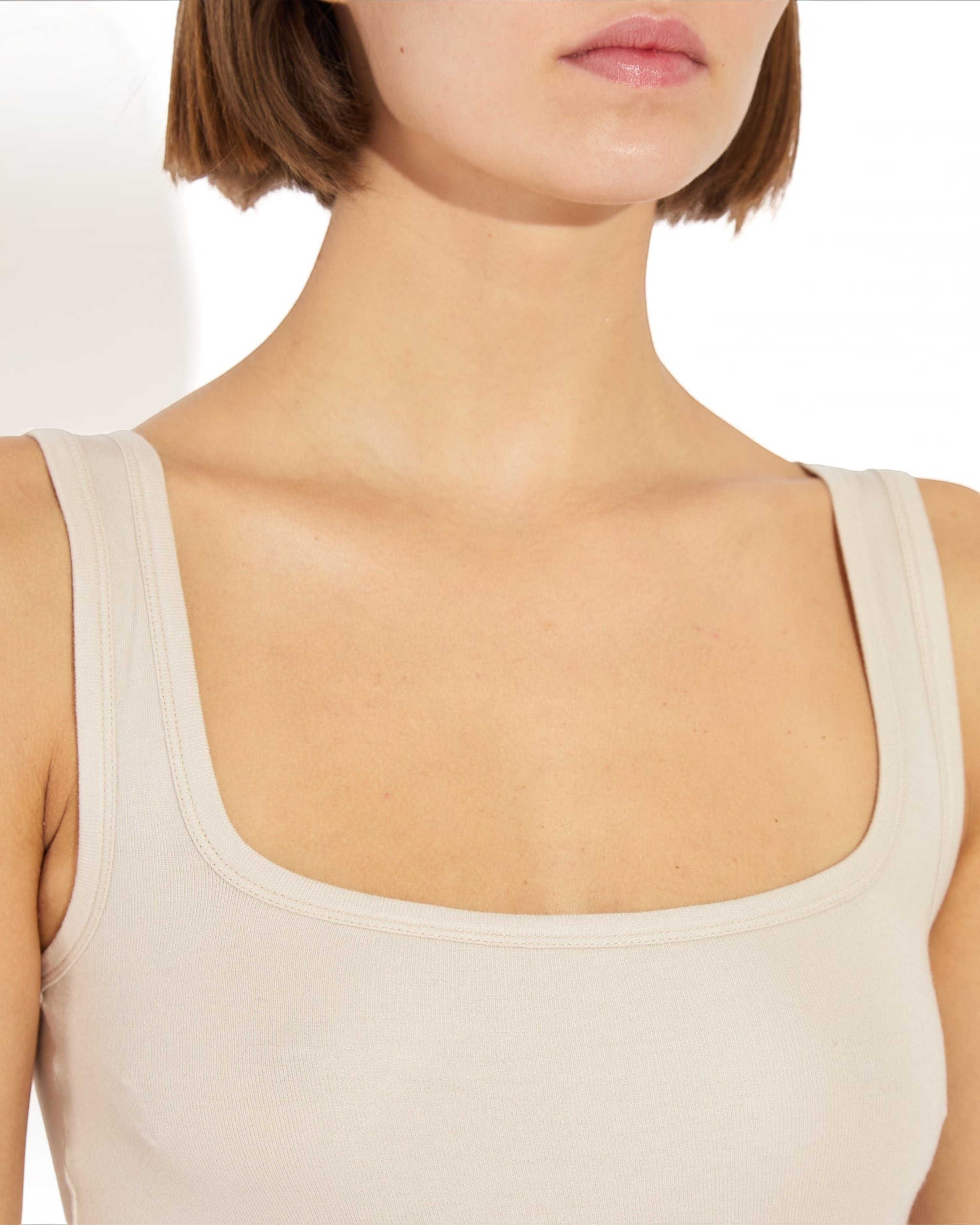 Weldun Lisa tank bodysuit in beige featuring a scoop neckline and supportive, breathable MicroTencel fabric.