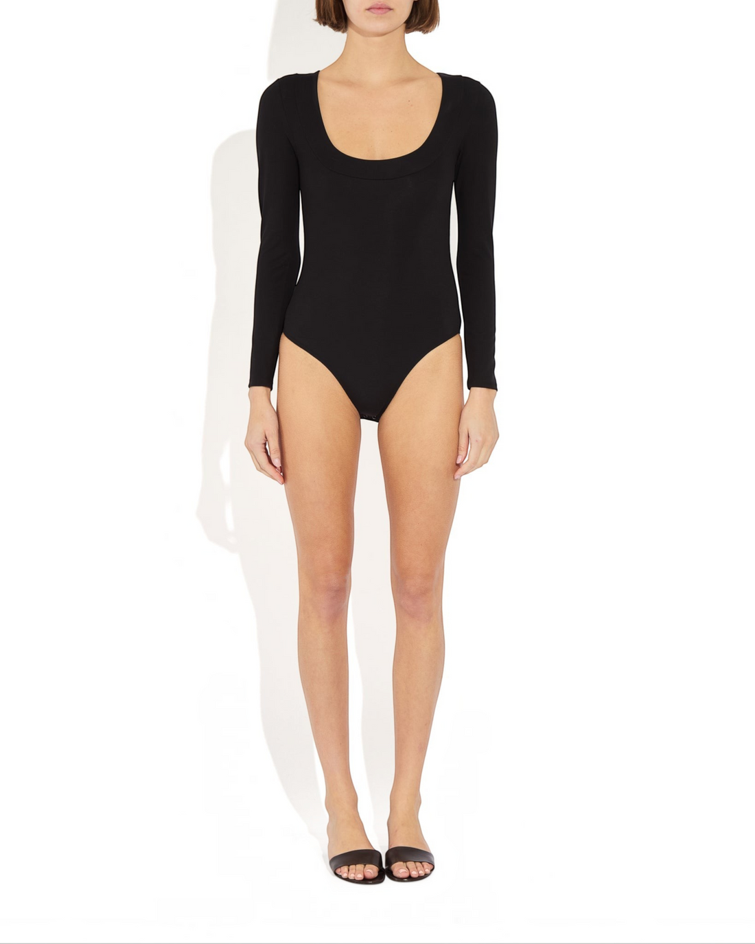 Weldun Maranda black long-sleeve bodysuit with a low scoop neckline and structured banded finish on a model