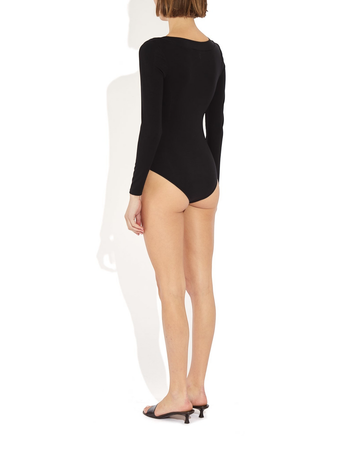 Weldun Maranda long sleeve black bodysuit with full bottom coverage and scoop neckline worn by a model, back view