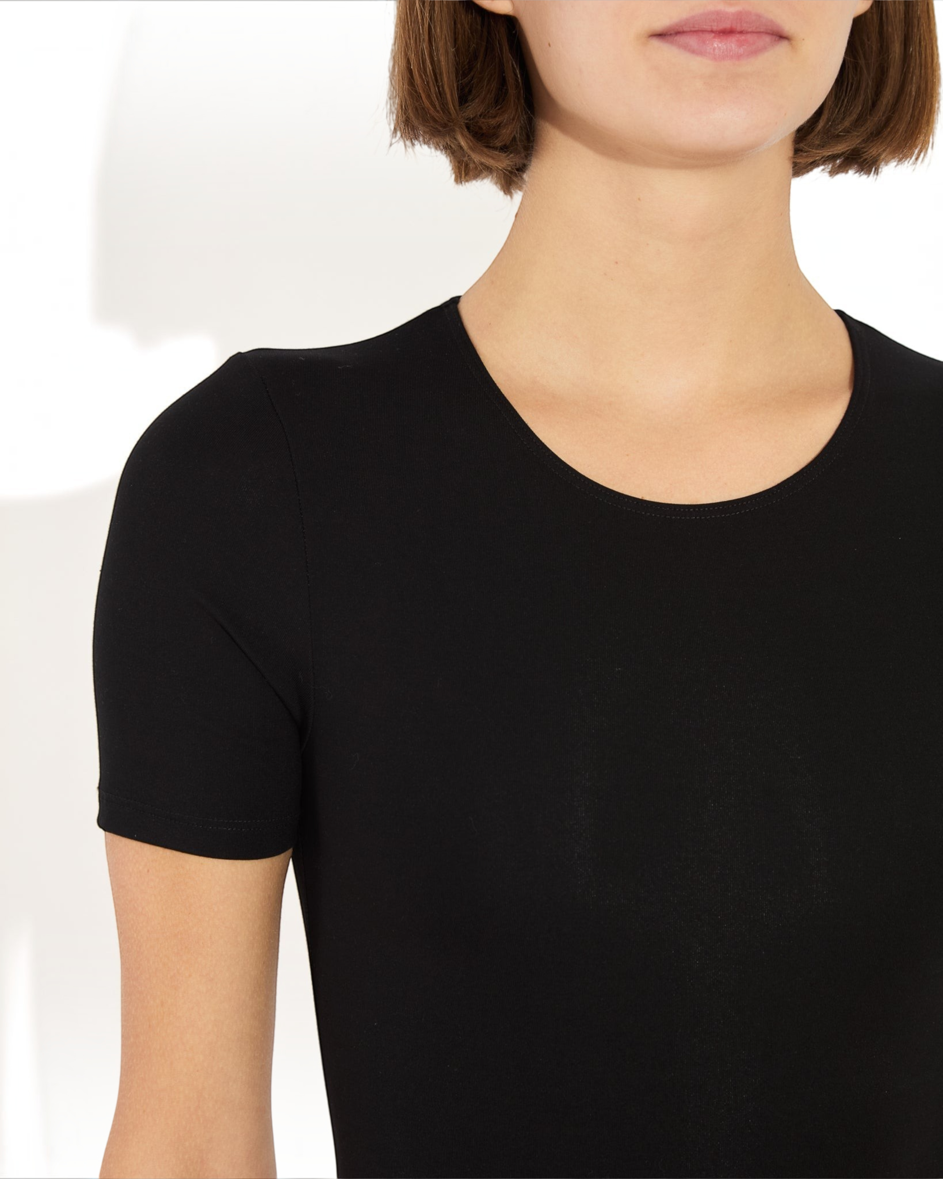 Weldun Penny short-sleeve black MicroTencel bodysuit with a ballerina neckline on a model