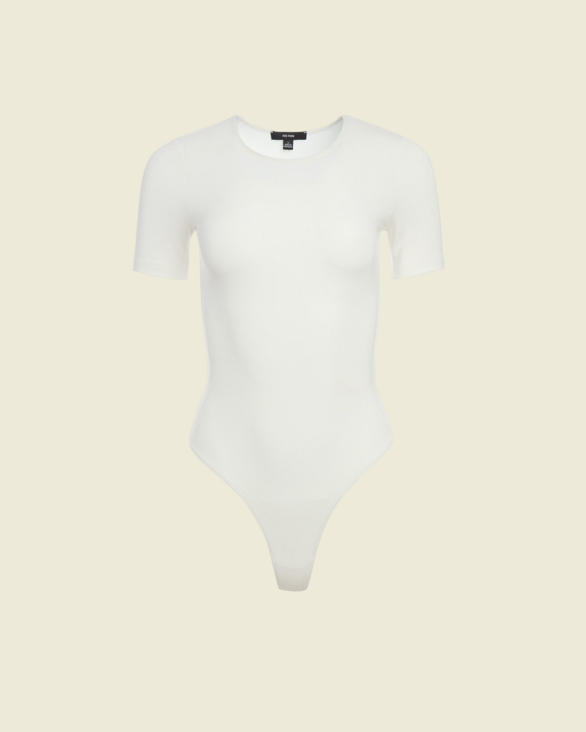 Weldun Penny short-sleeve bodysuit in white MicroTencel fabric featuring a ballerina neckline and cheeky cut.