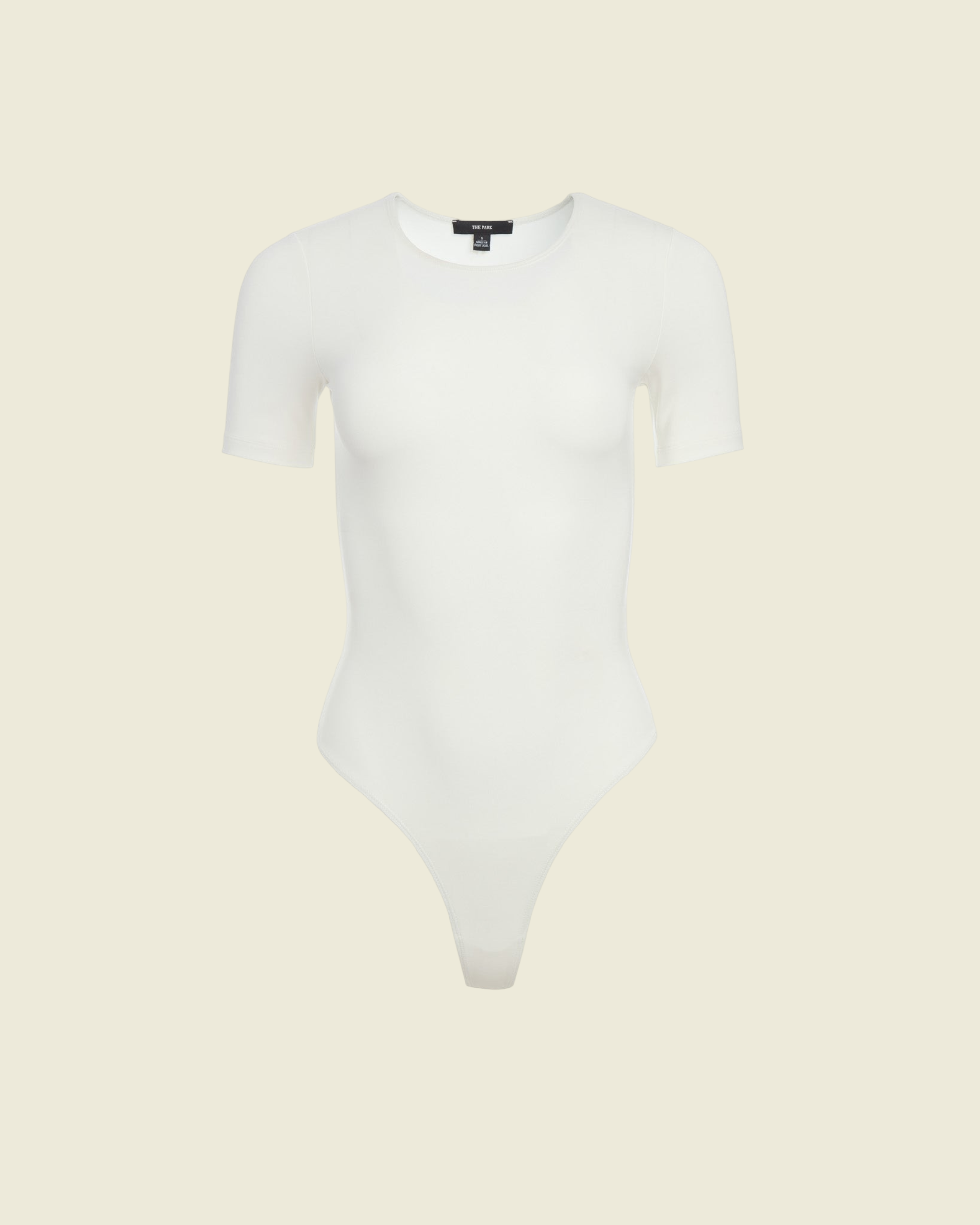 Weldun Penny short-sleeve bodysuit in white MicroTencel fabric featuring a ballerina neckline and cheeky cut.
