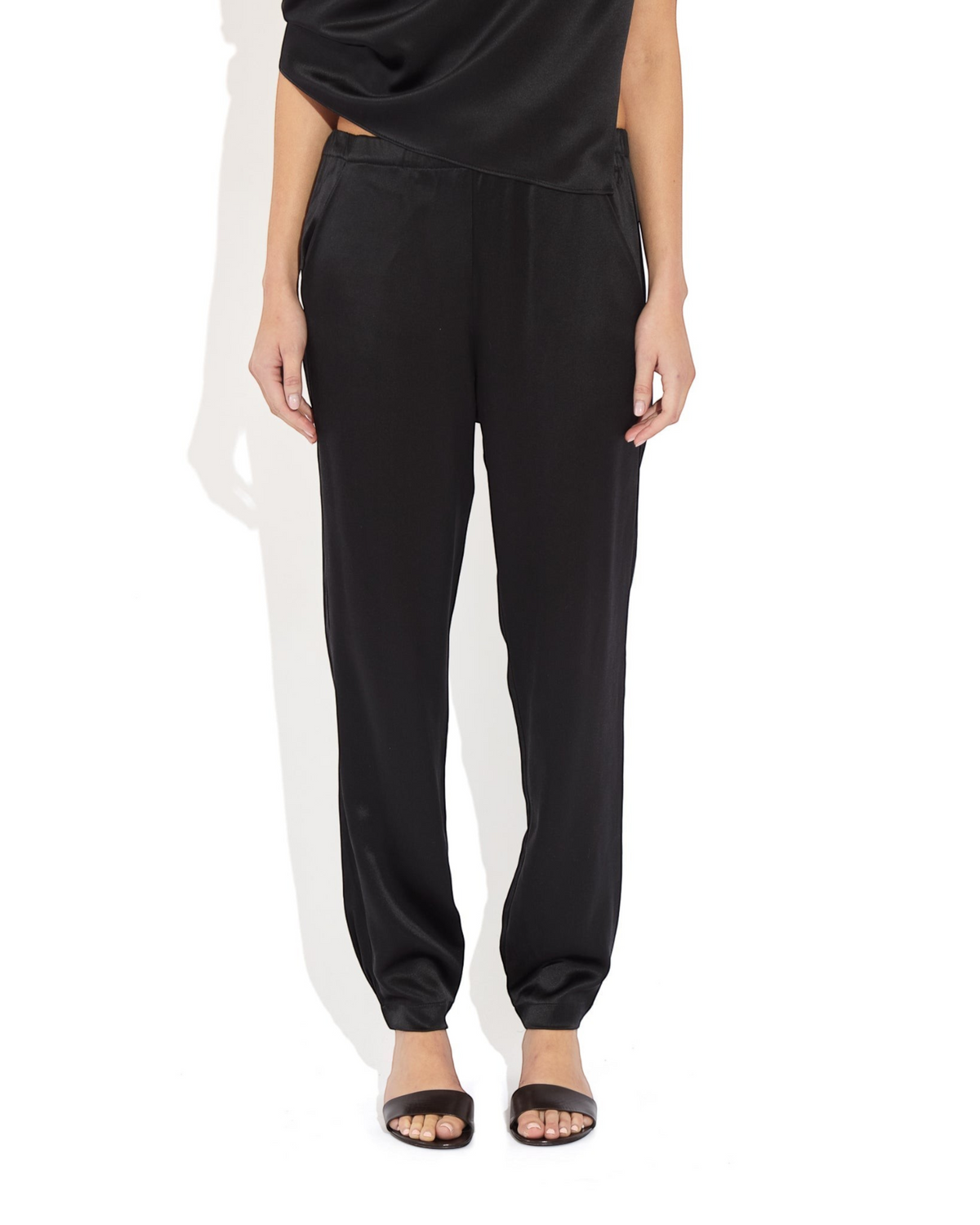 Weldun Rebecca Jogger in black mulberry silk with a relaxed tapered leg, elastic waistband, and cuffed hems.