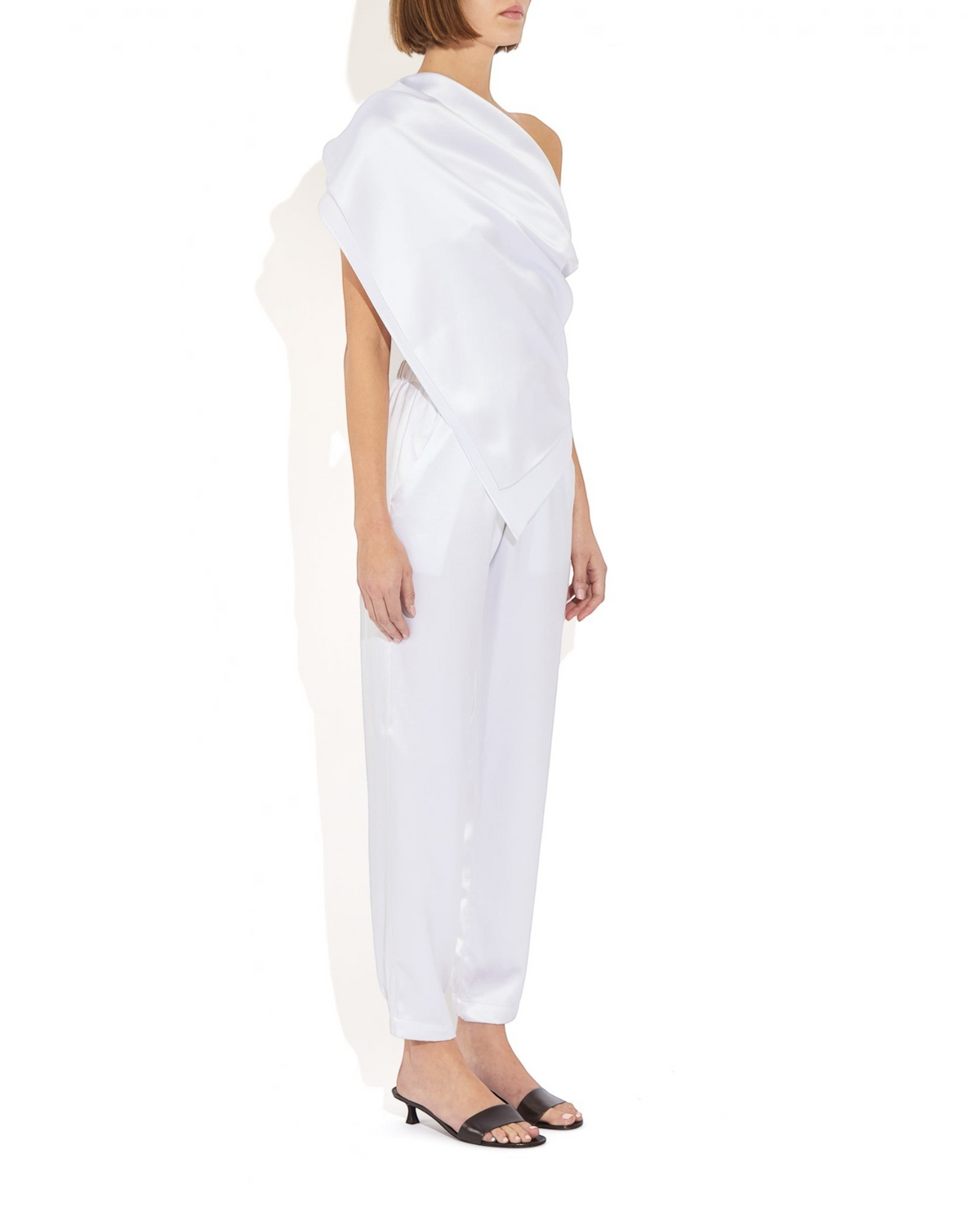 Weldun Rebecca Jogger in white mulberry silk with a tapered leg, elastic waistband, and side pockets on a model