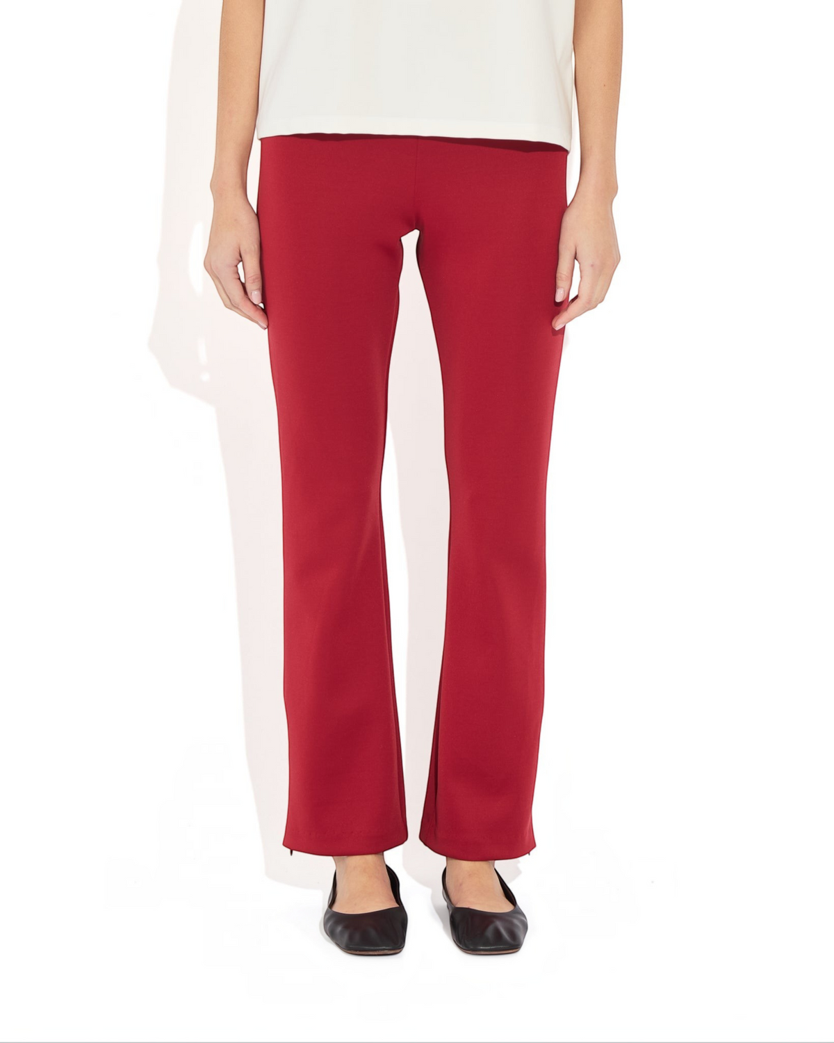 Weldun Sarah Pant in deep red recycled polyester with an elastic waistband and adjustable side hem zippers.
