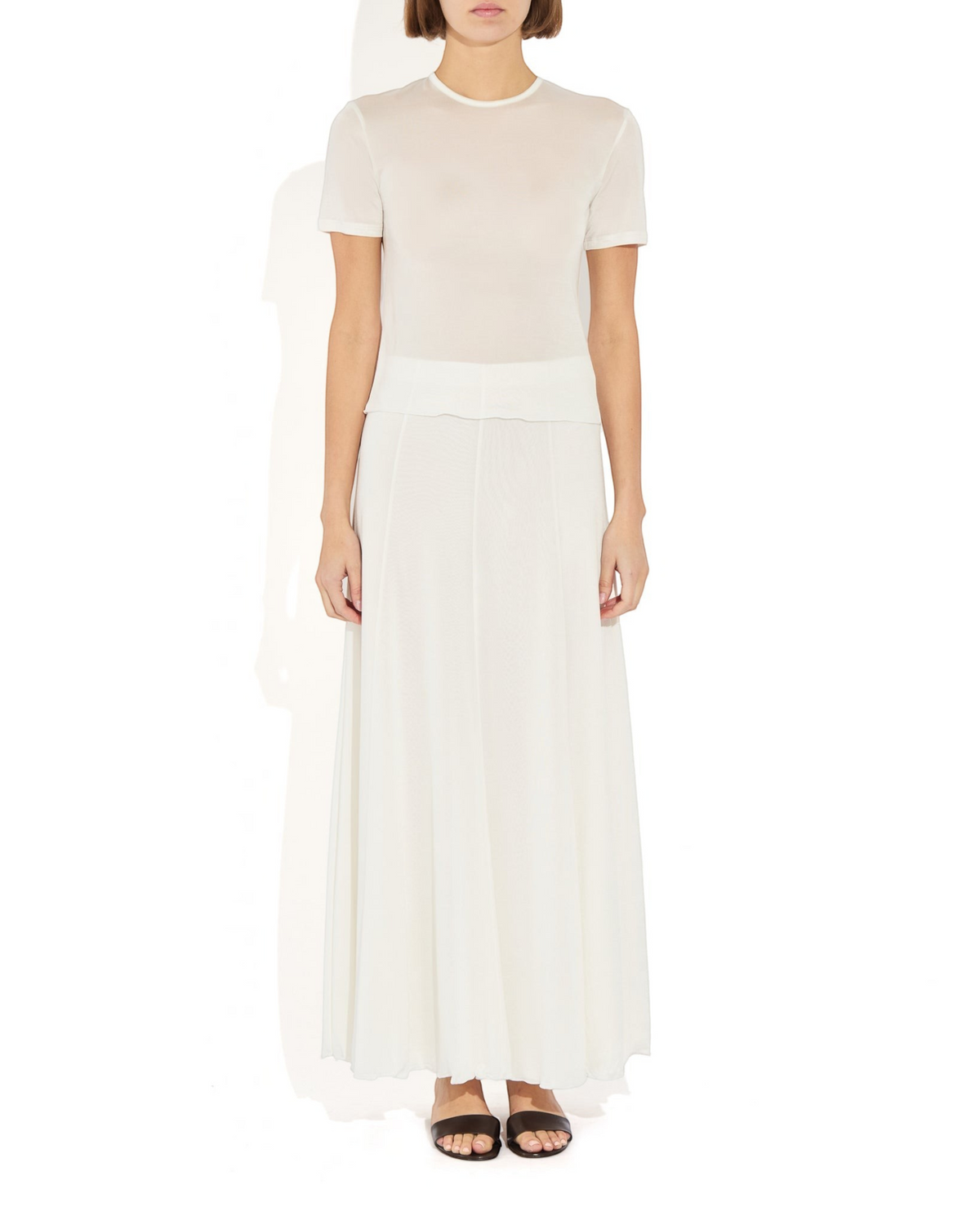 Weldun semi-sheer white Olivia maxi skirt in soft lyocell with an elastic waistband and fluid paneled construction.
