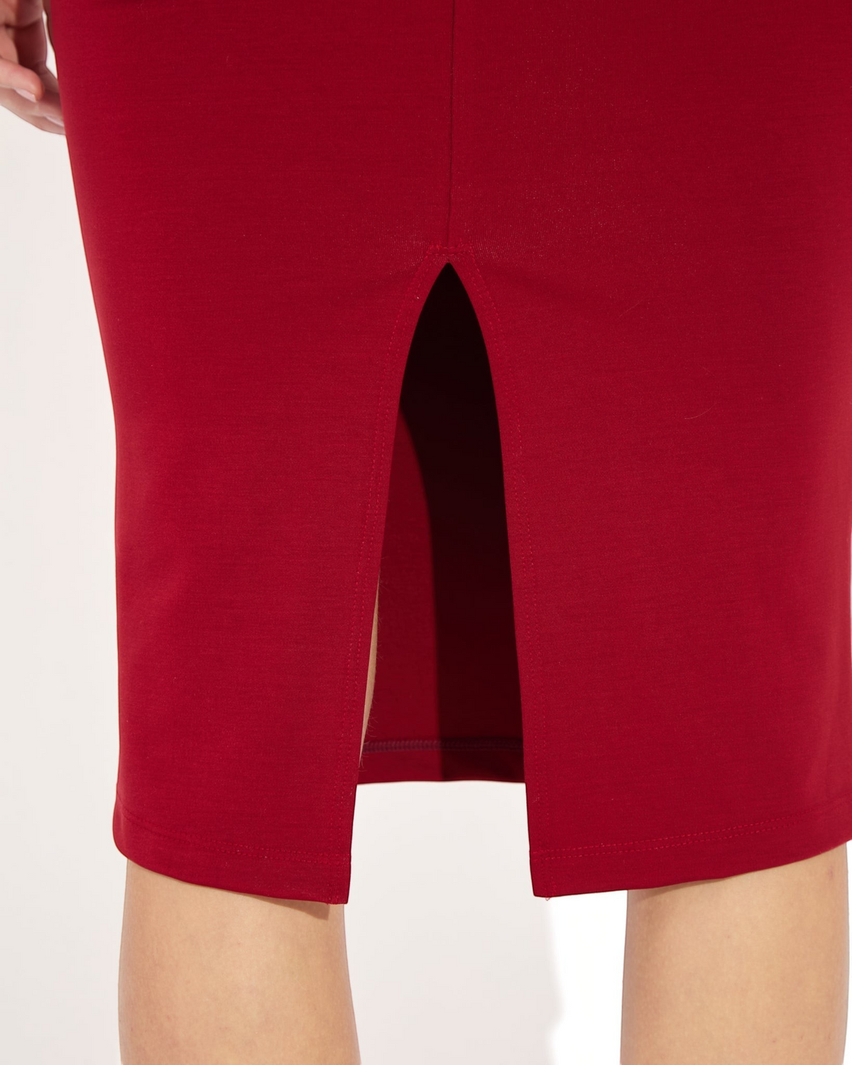 Weldun Sheryl Skirt in deep red MicroTencel fabric featuring a back slit for movement and a comfortable pull-on fit.