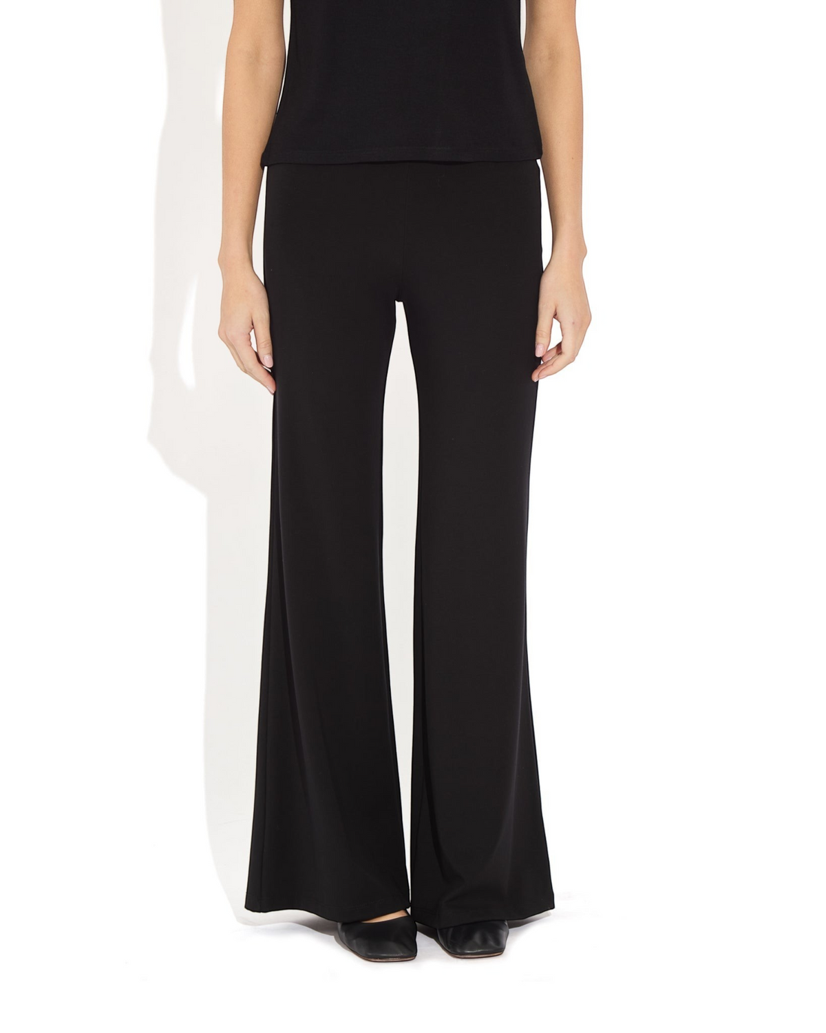 Weldun Tessa Long Pant in black featuring a high elasticated waist and fluid flare leg in soft breathable PYRATEX