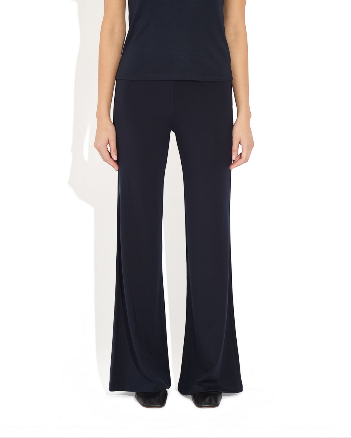 Weldun Tessa long pull-on flare pants in black, made from soft breathable PYRATEX fabric with a high elastic waist.