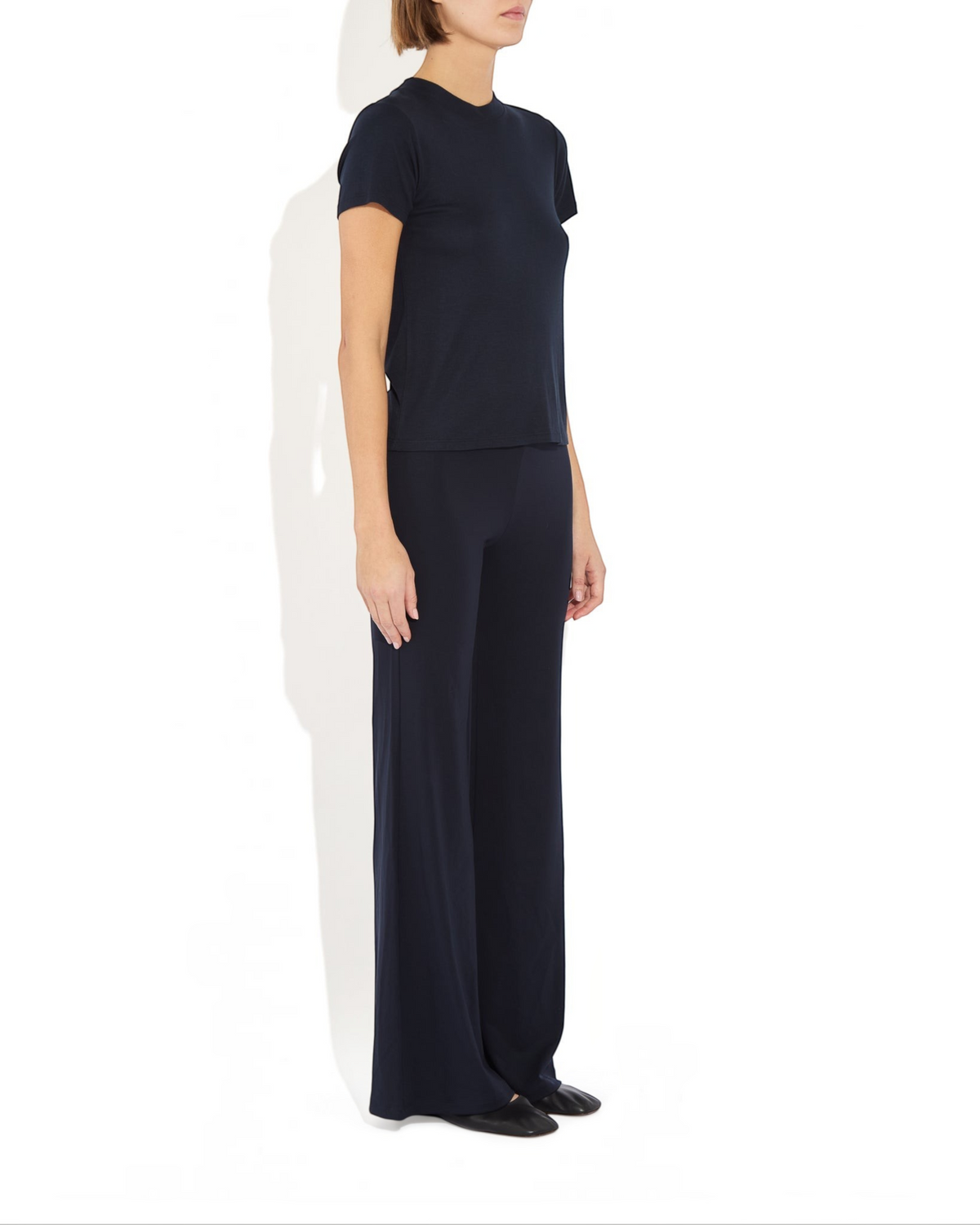 Weldun Tessa long pant in black featuring a high elasticated waist and fluid flare leg in soft breathable fabric
