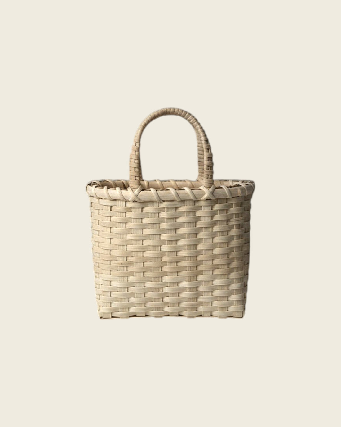 Weldun Little Shopper hand-woven rattan basket with wrapped handles in a natural light beige finish