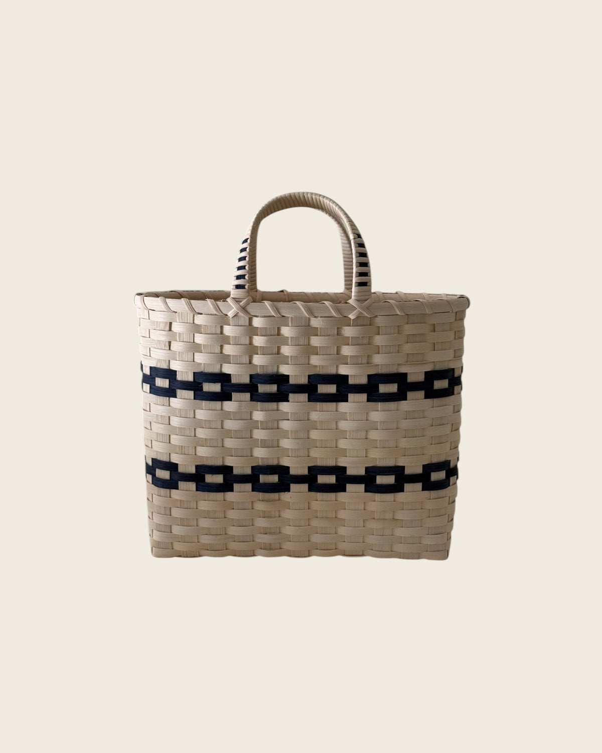 Weldun New England woven rattan shopping basket with natural light wood finish and contrasting black geometric bands.