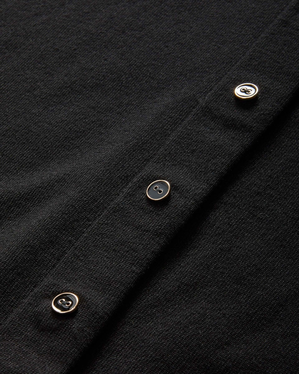 Weldun black adaptive knit cardigan featuring hidden magnetic fasteners behind faux buttons for easy dressing