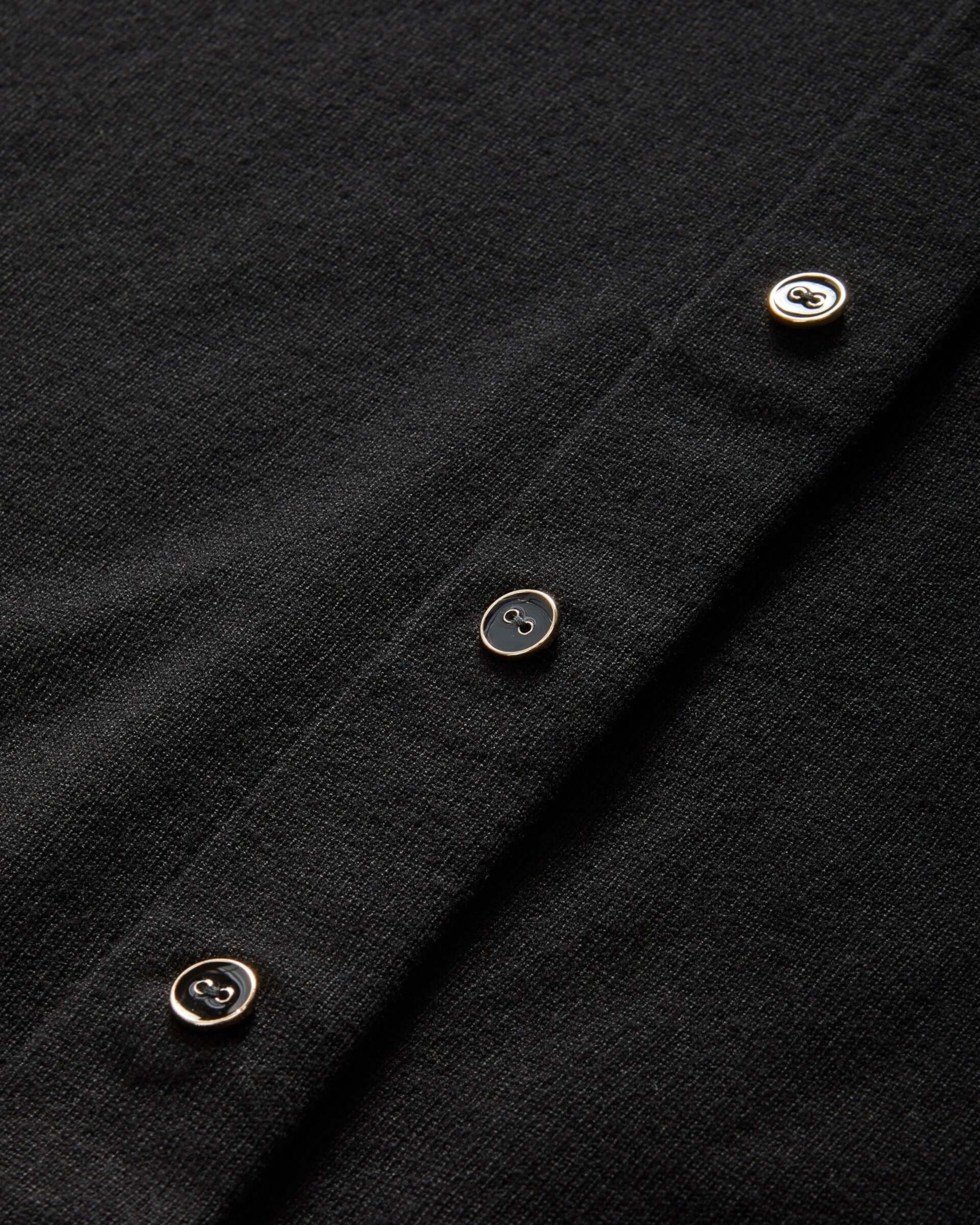 Weldun black adaptive knit cardigan featuring hidden magnetic fasteners behind faux buttons for easy dressing