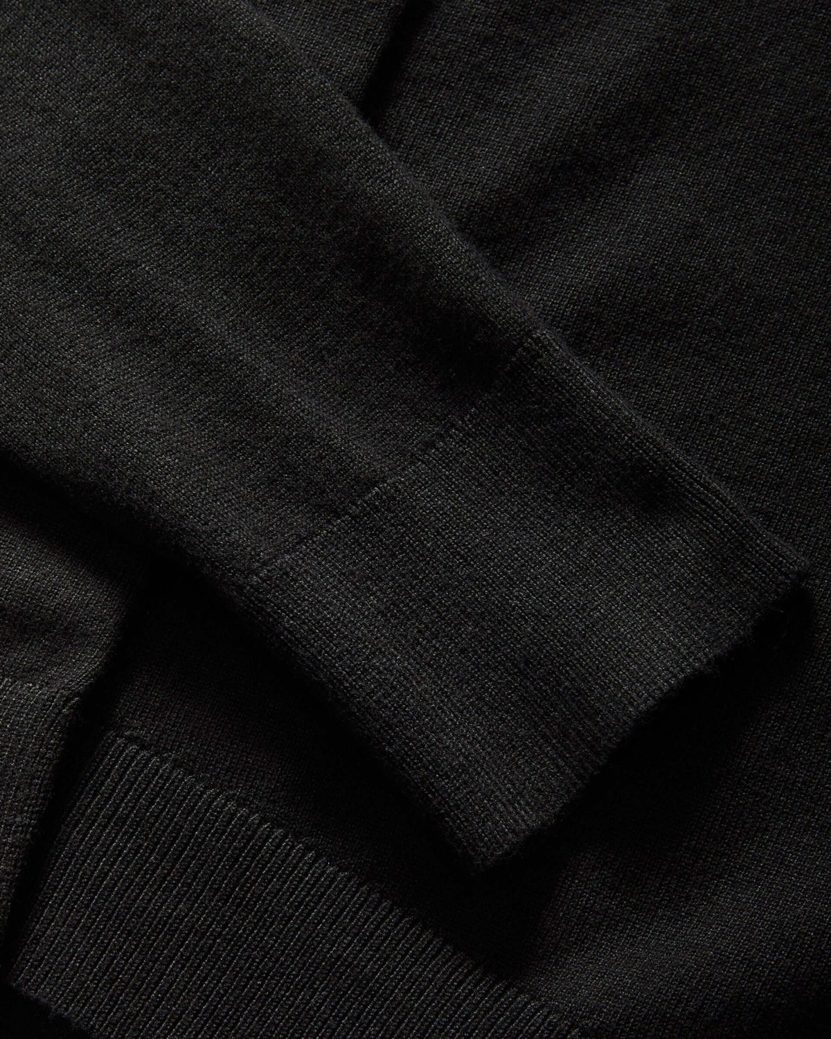 Weldun black adaptive knit cardigan sweater featuring a faux button with hidden magnetic closure on the cuff