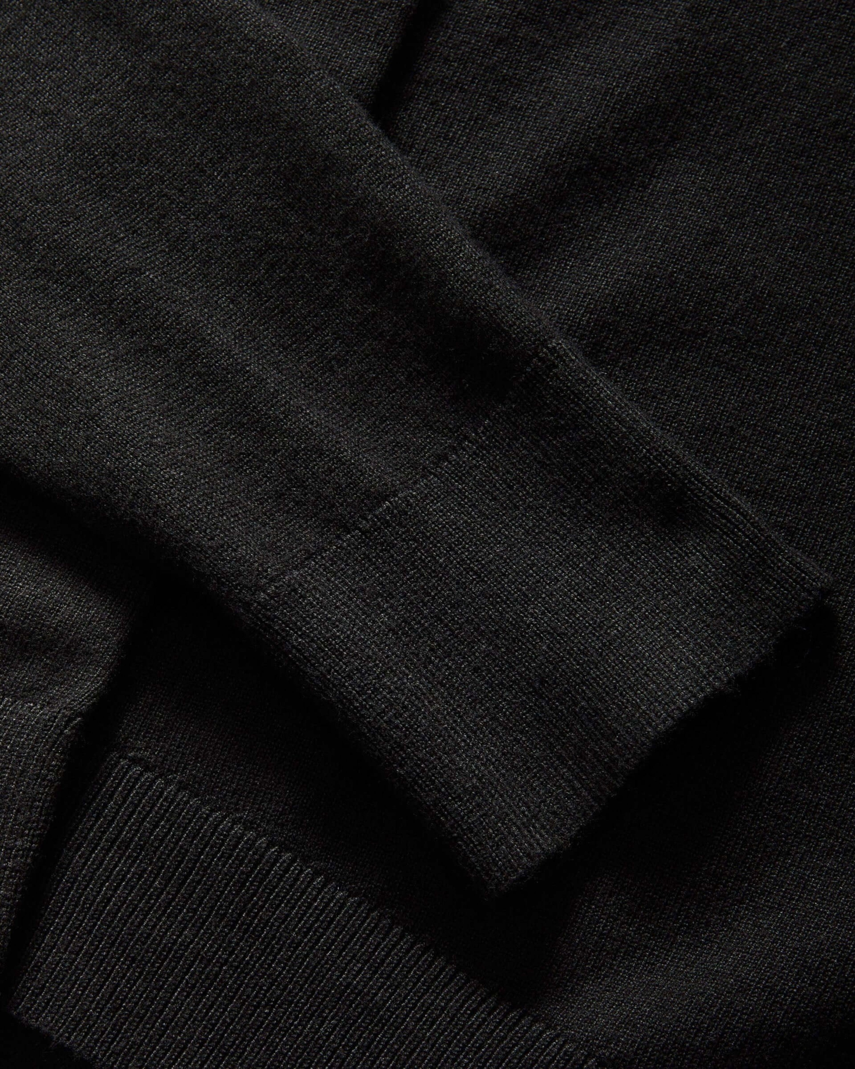Weldun black adaptive knit cardigan sweater featuring a faux button with hidden magnetic closure on the cuff
