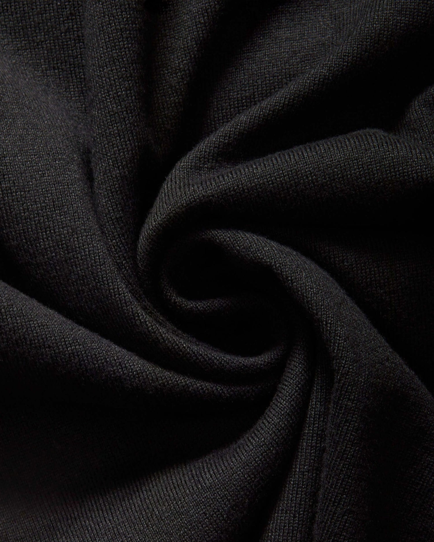 Weldun black knit fabric texture of the MagnaReady adaptive cardigan sweater showing soft rayon and nylon blend